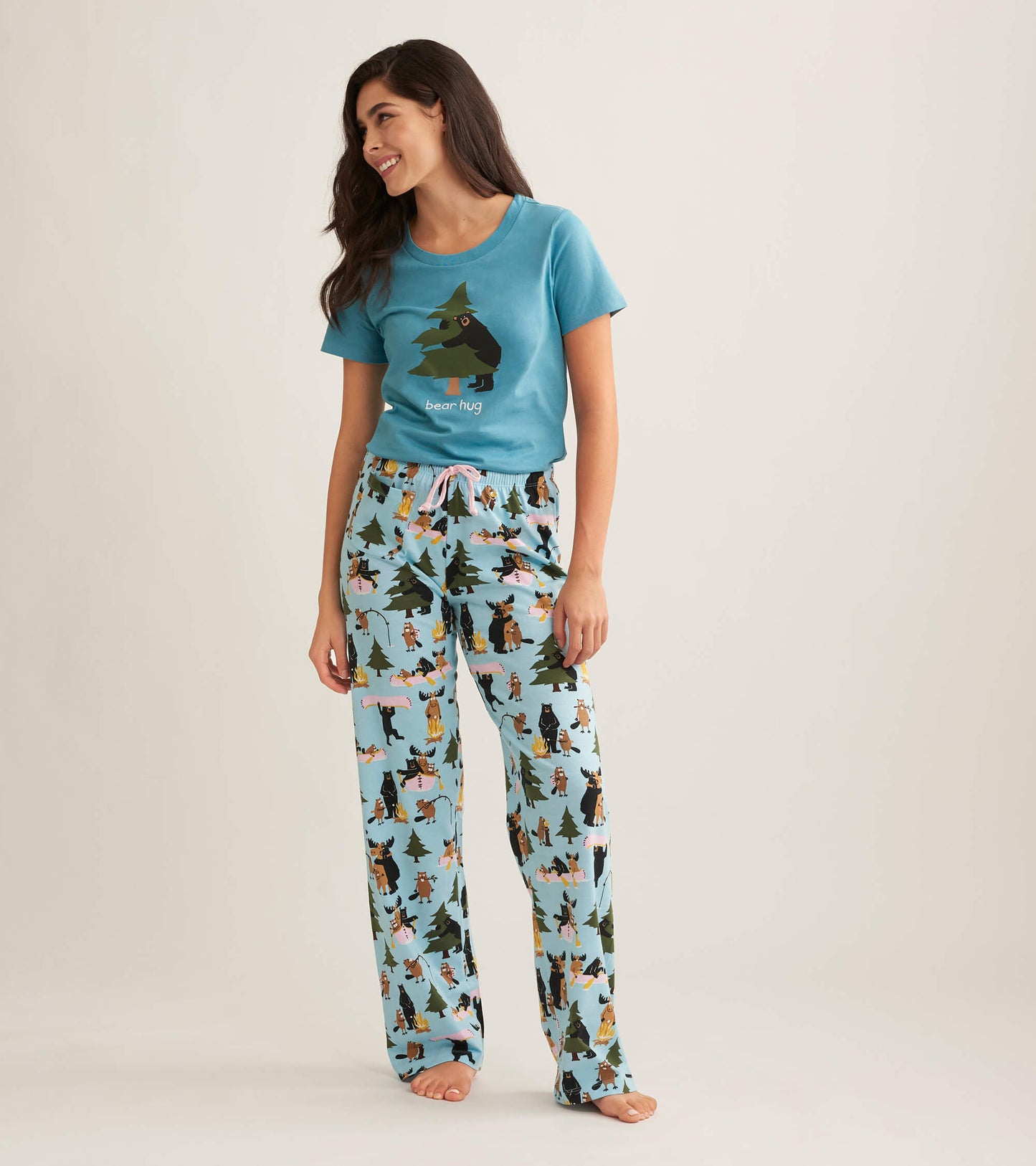 Light blue cotton pajama pants with a playful animal and tree pattern, featuring an elastic waistband and drawstring.