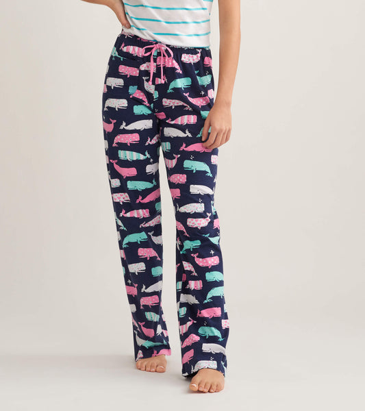 Navy cotton pajama pants featuring colorful whale patterns and a drawstring waist, ideal for casual lounging.
