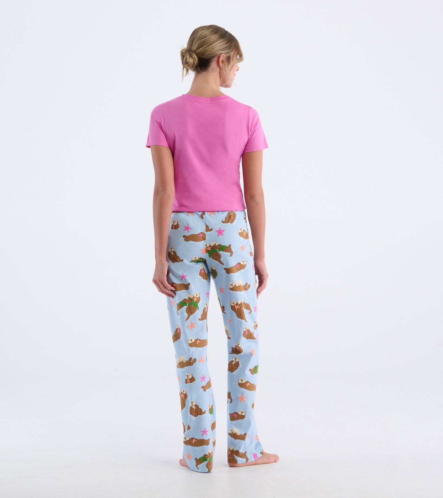 Light blue cotton pajama pants featuring a playful otter and starfish pattern, shown from the back.