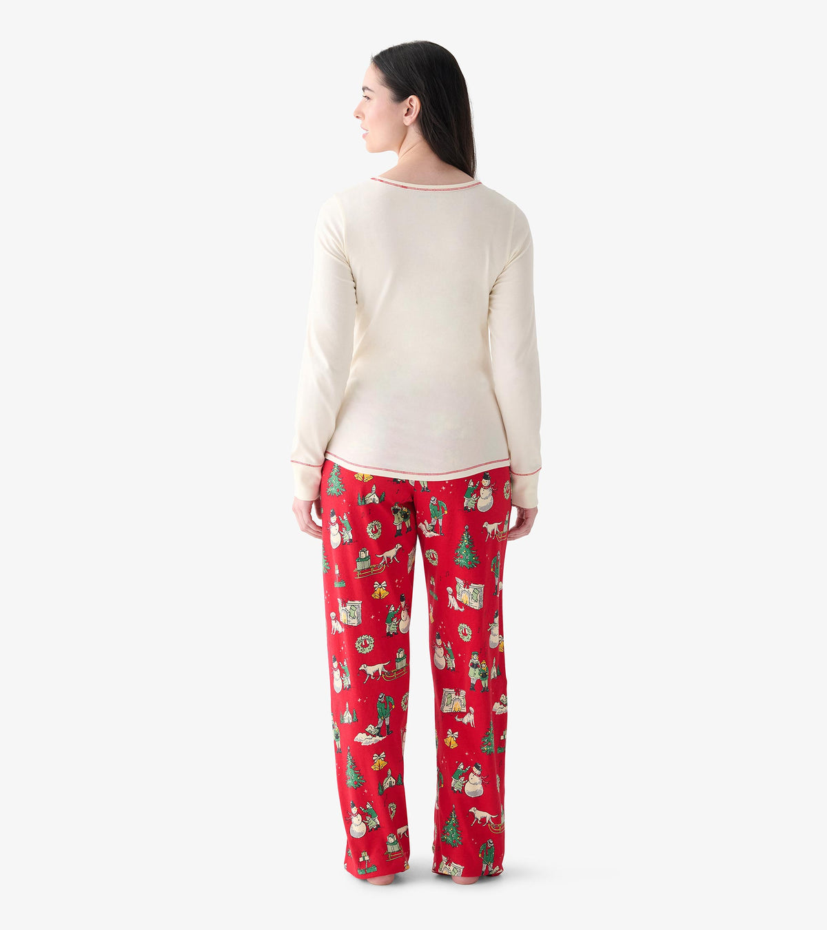 Back view of red Christmas pajama pants with vintage holiday print, shown on model