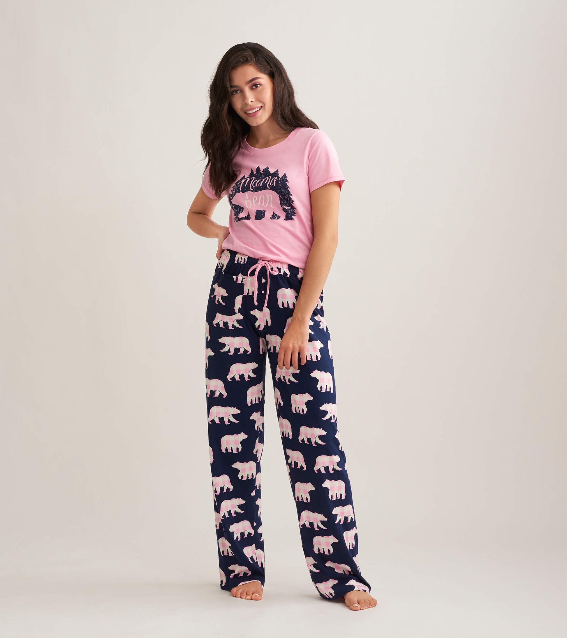 Navy cotton pajama pants with a pink bear pattern, featuring an elastic waistband and drawstring.