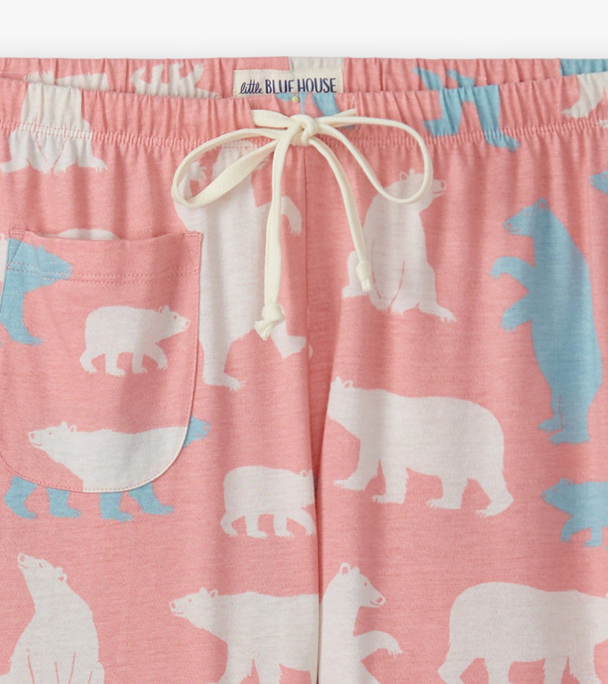 Pink cotton pajama pants featuring a polar bear pattern, with a drawstring waist and side pocket.