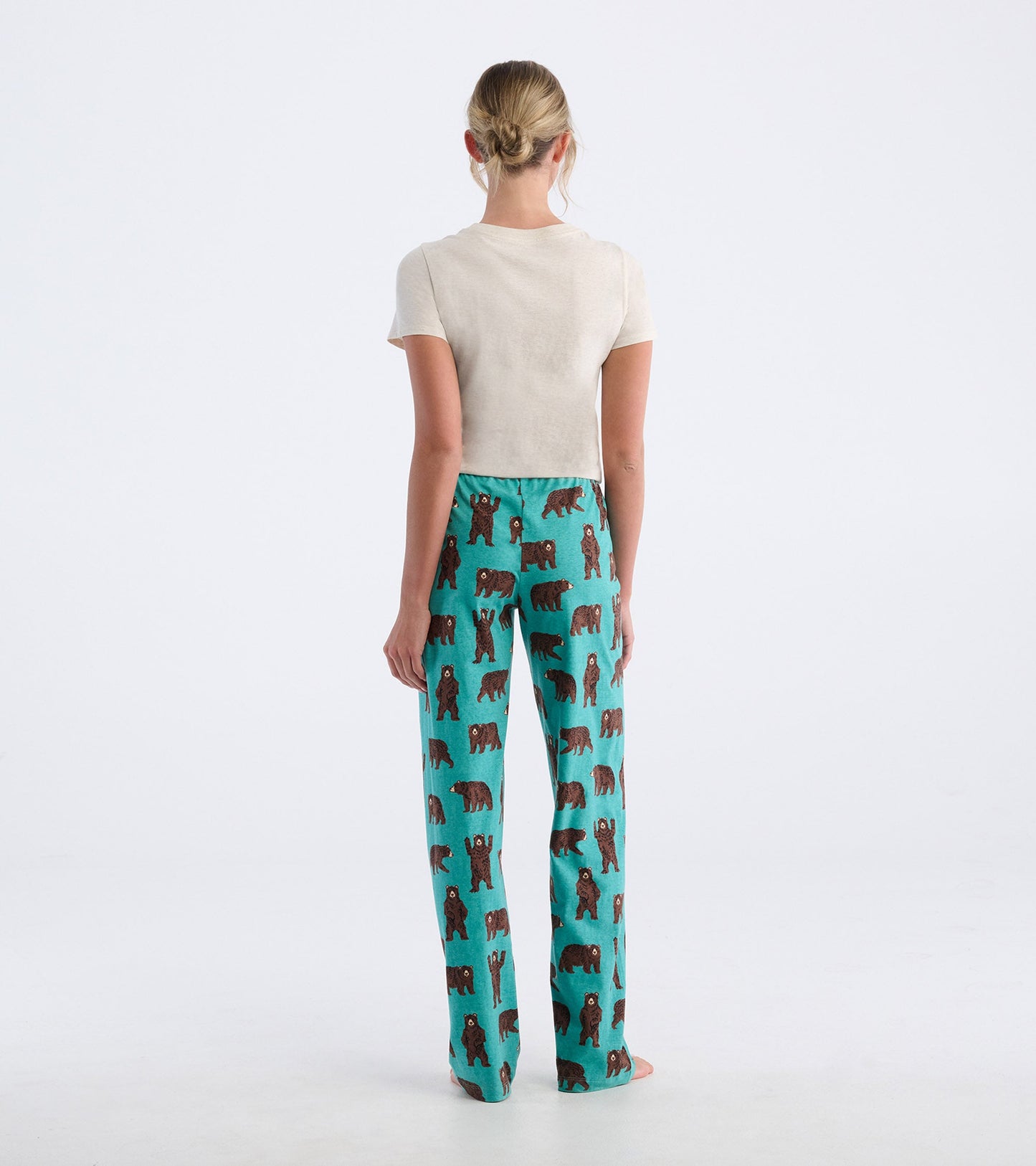 Women's pajama pants in turquoise with a brown bear pattern, featuring a relaxed fit and soft cotton material.