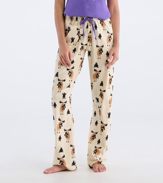 Beige cotton pajama pants featuring a playful moose and bear pattern, with an elastic waistband and drawstring.