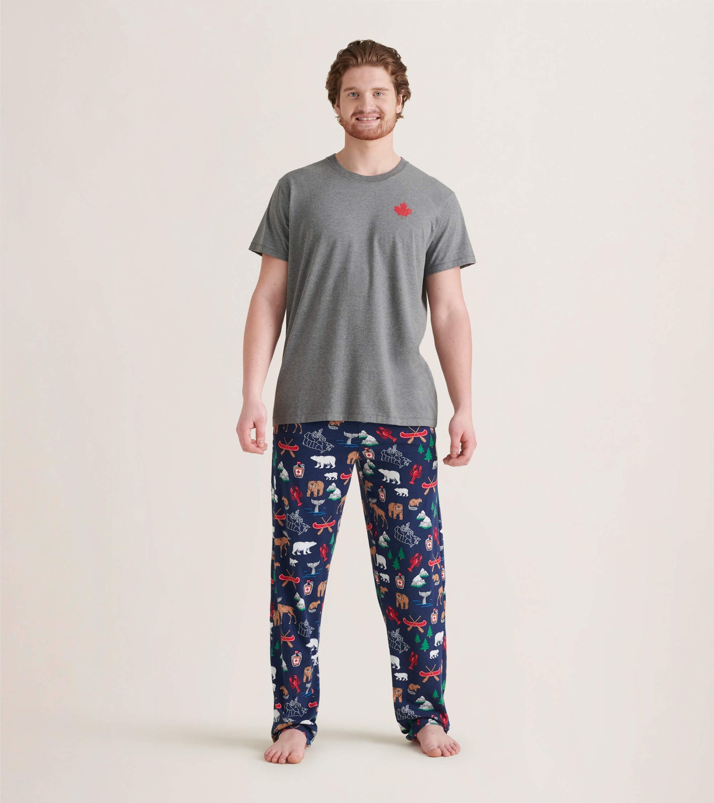 Men's pajama pants in navy with colorful animal and holiday patterns, made of stretch cotton for comfort.