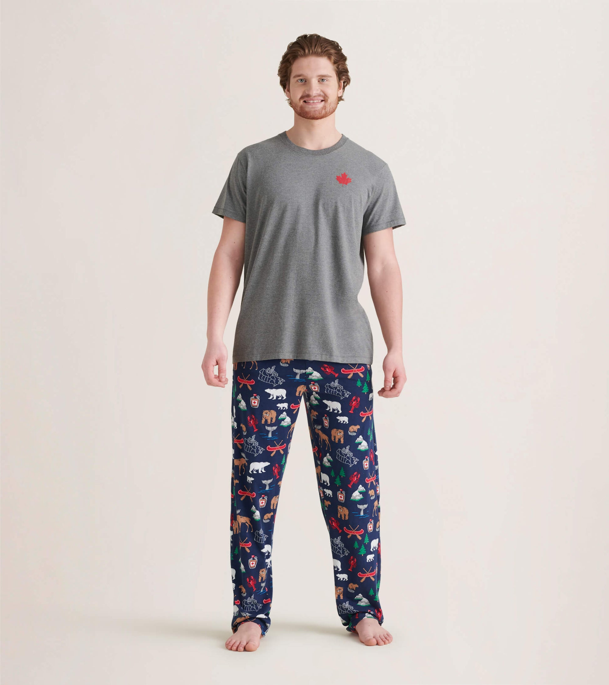 Men's pajama pants in navy with colorful animal and holiday patterns, made of stretch cotton for comfort.