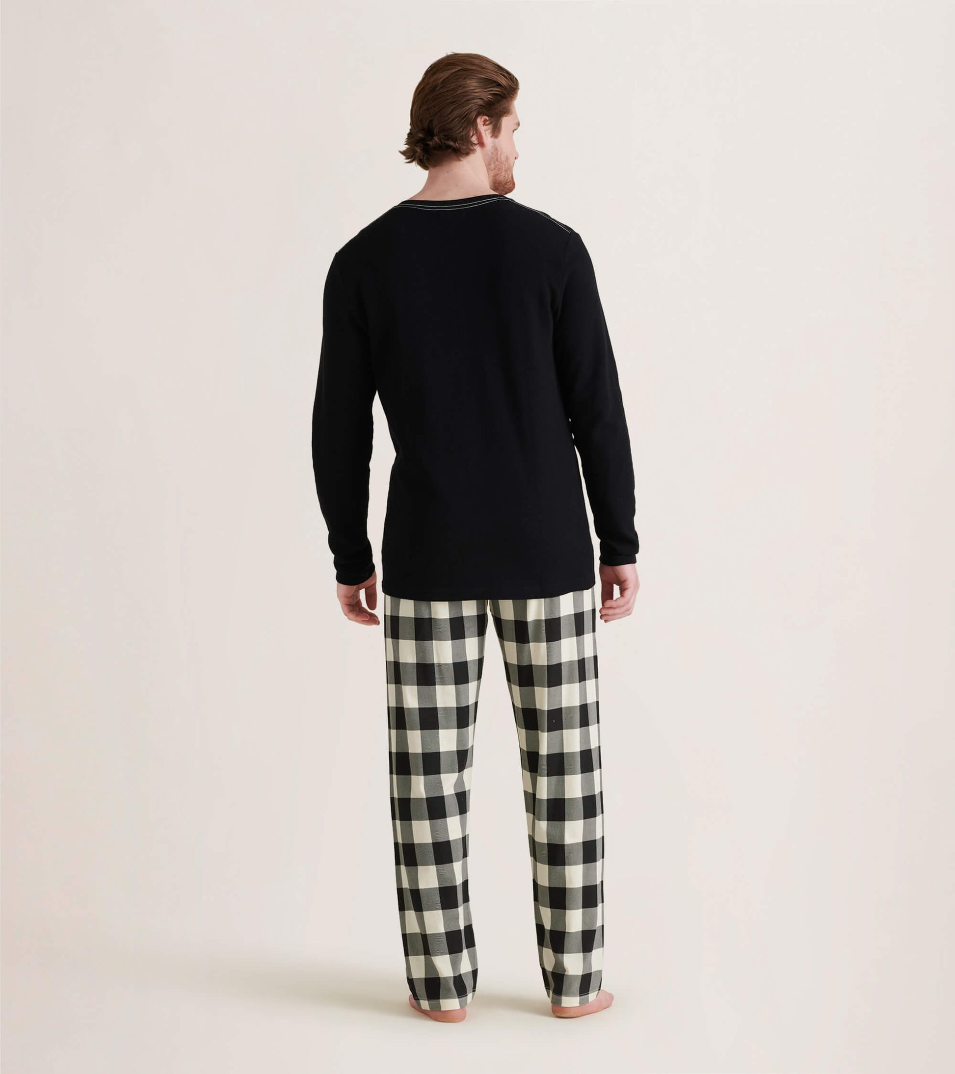 Men's cream plaid stretch cotton pajama pants, featuring a relaxed fit and elastic waistband, shown from the back.
