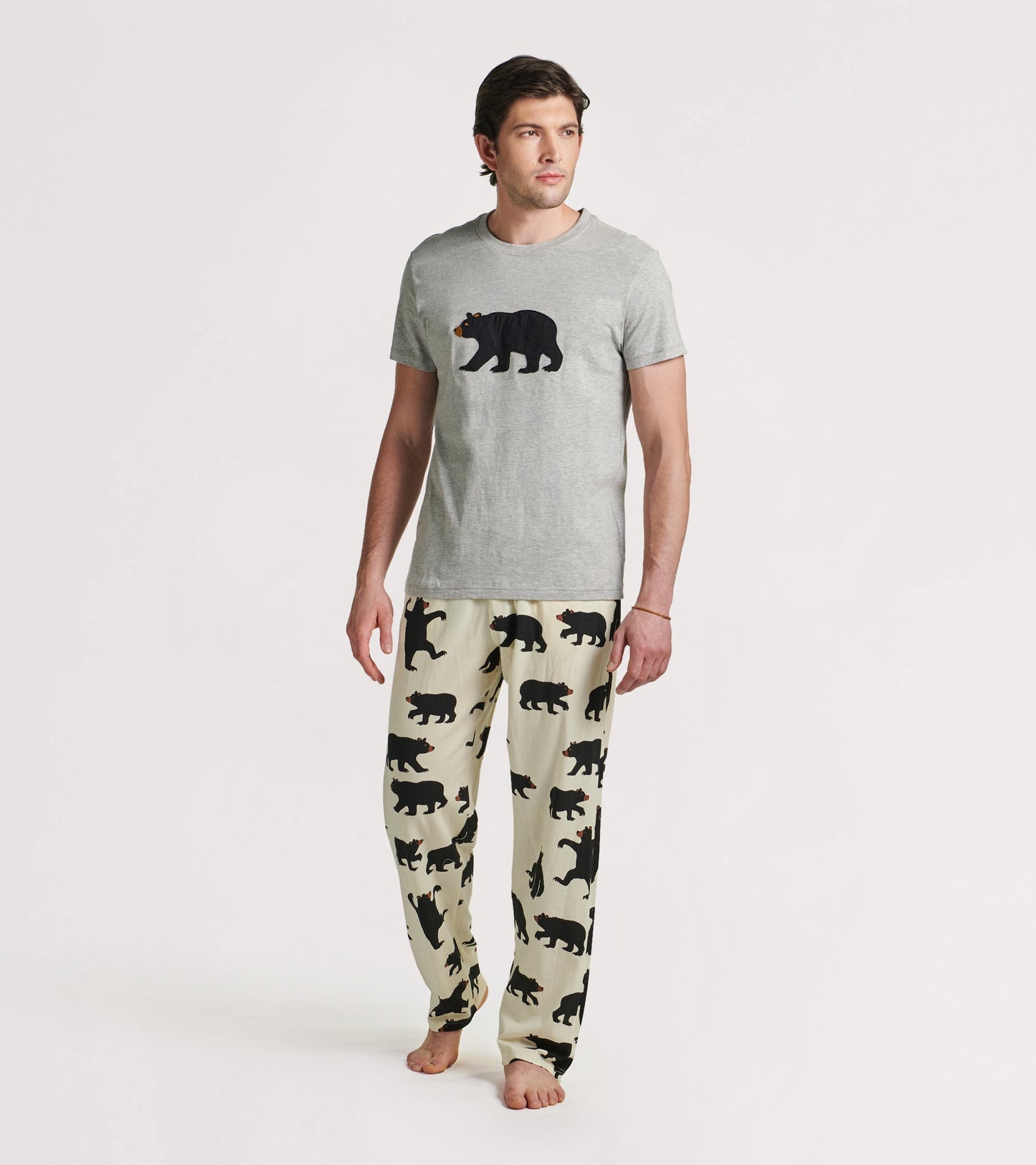 Men's stretch cotton pajama pants in cream with black bear silhouettes, designed for comfort and relaxation.