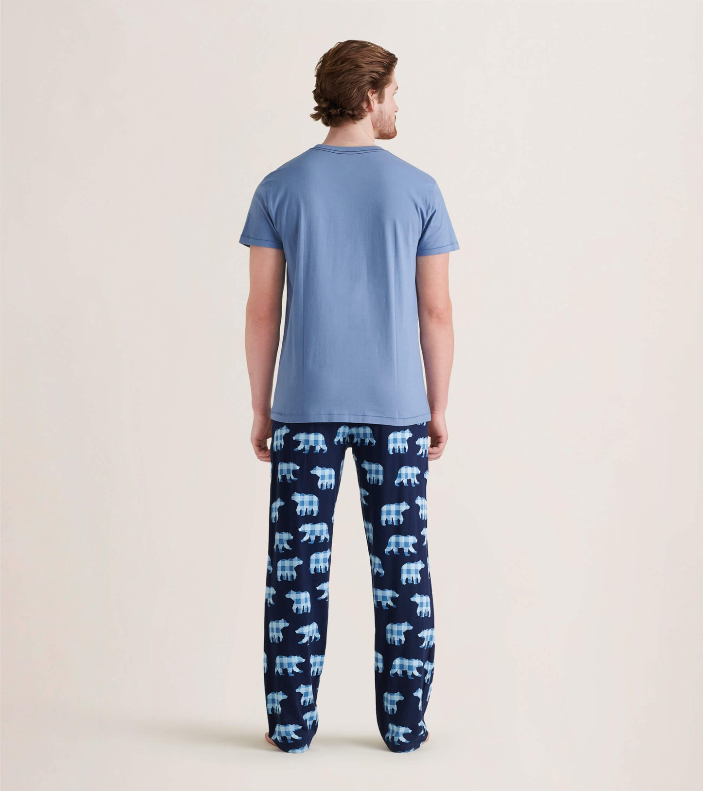 Men's pajama pants in navy with light blue bear pattern, made of stretch cotton, shown from the back.