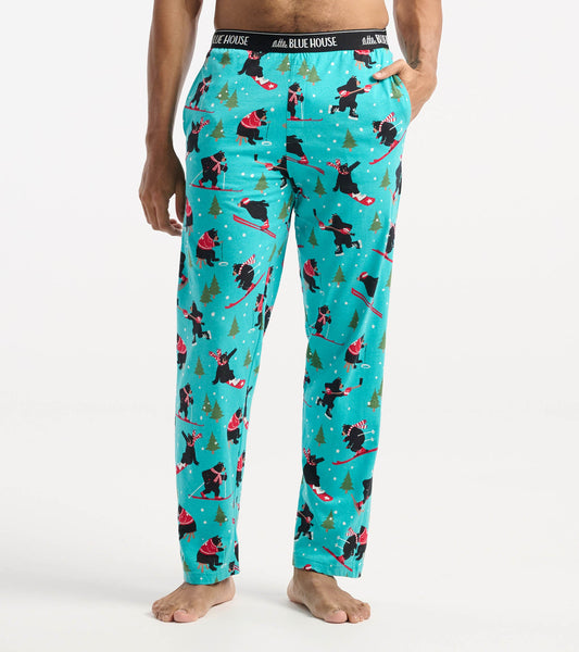 Turquoise cotton pajama pants featuring a playful winter sports bear pattern, with an elastic waistband and side pockets.