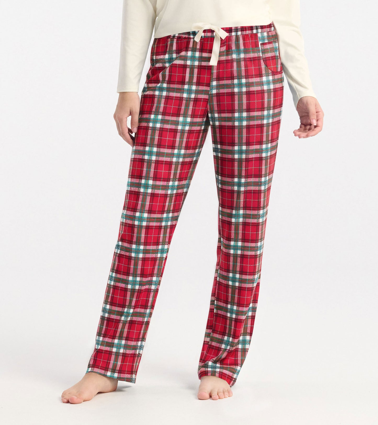 Red plaid polyknit pajama pants with an elastic waistband and pockets, suitable for casual wear or lounging.