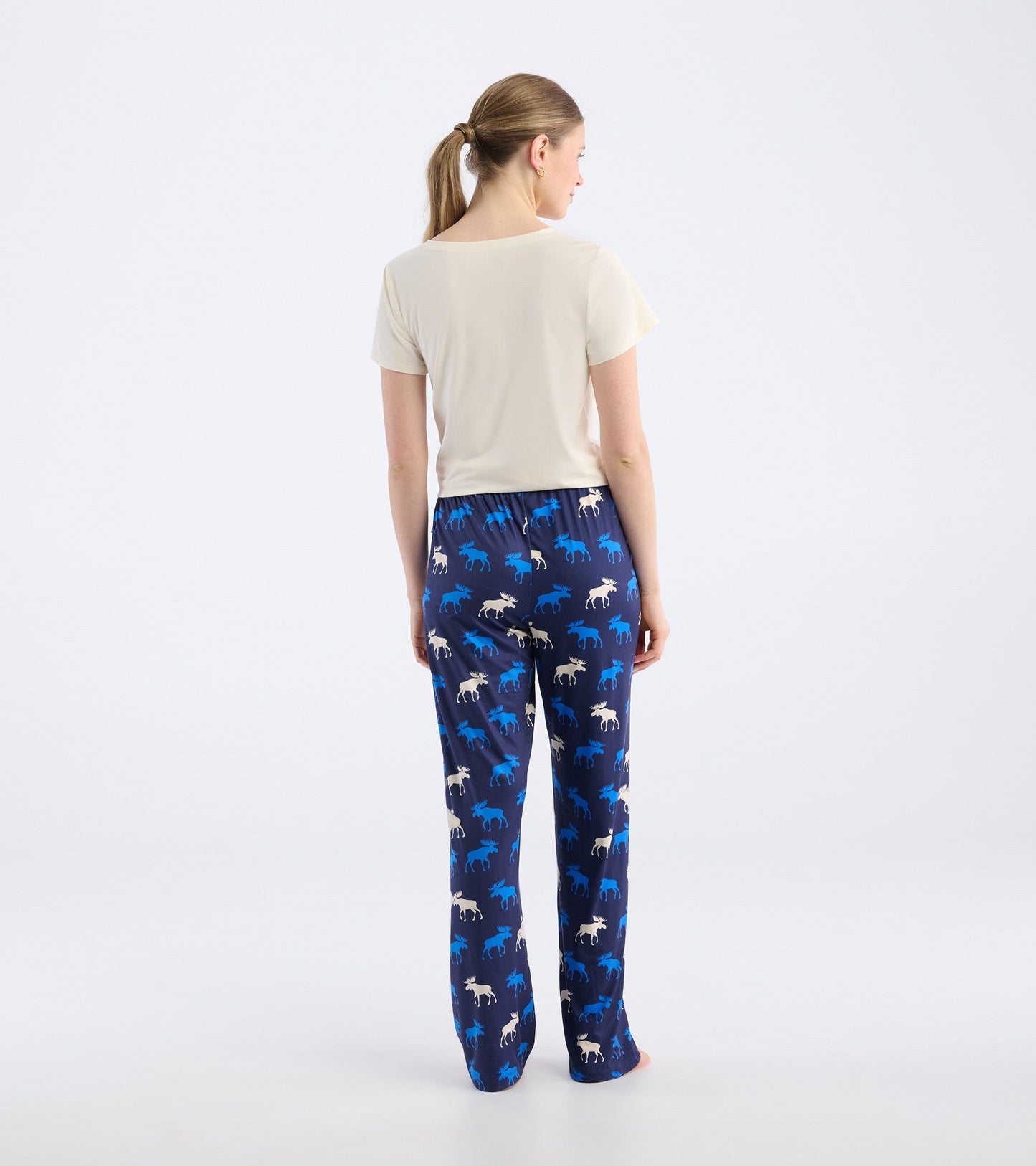 Navy pajama pants featuring a moose pattern in blue and white, designed for comfort and relaxation.