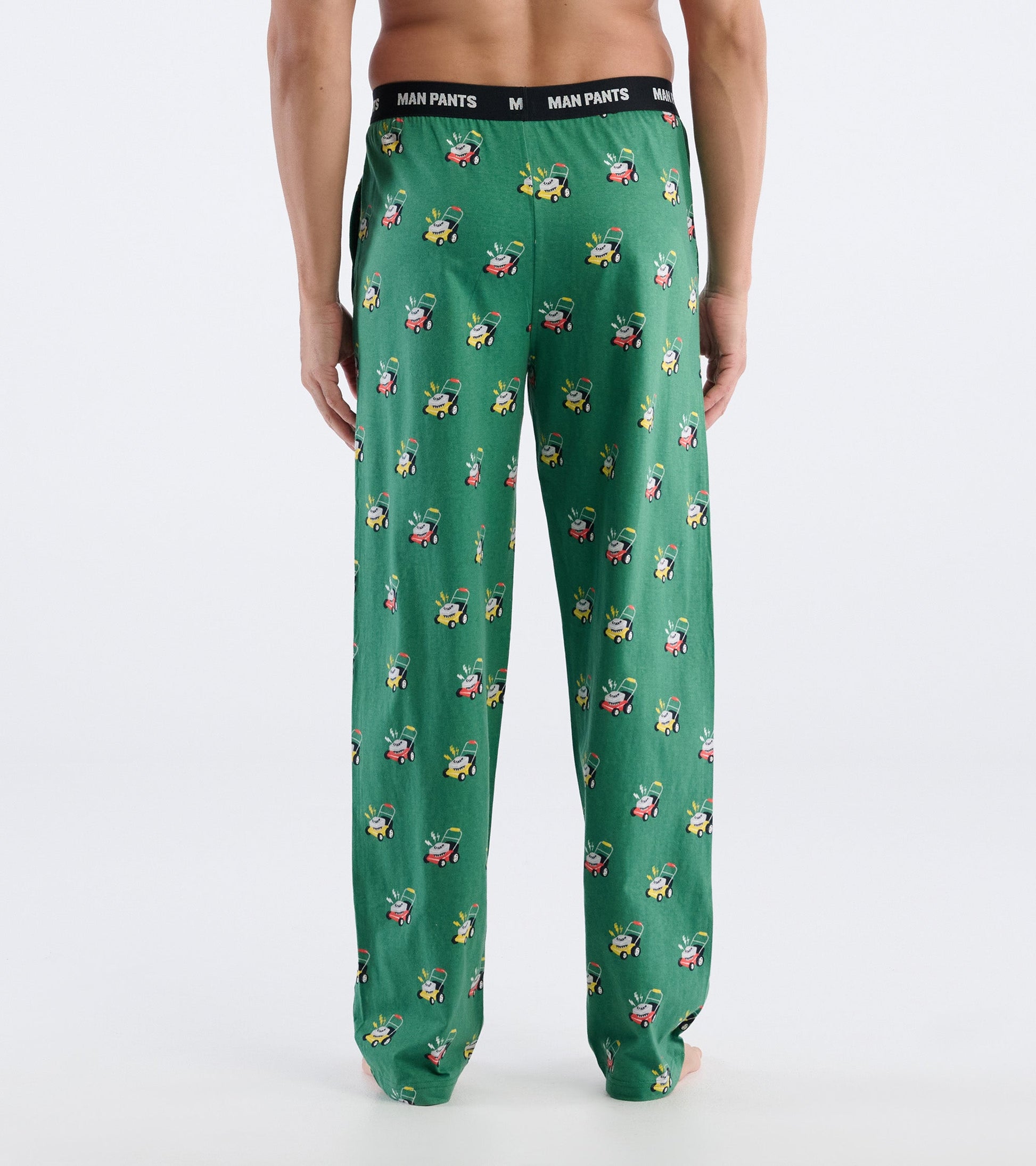 Green pajama pants featuring a playful lawnmower print, with an elastic waistband and relaxed fit.