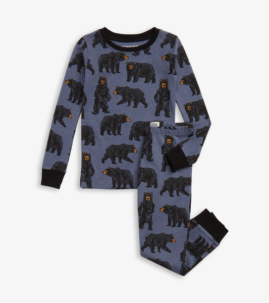 Blue pajama set featuring black bear patterns, with long sleeves and pants, designed for kids.