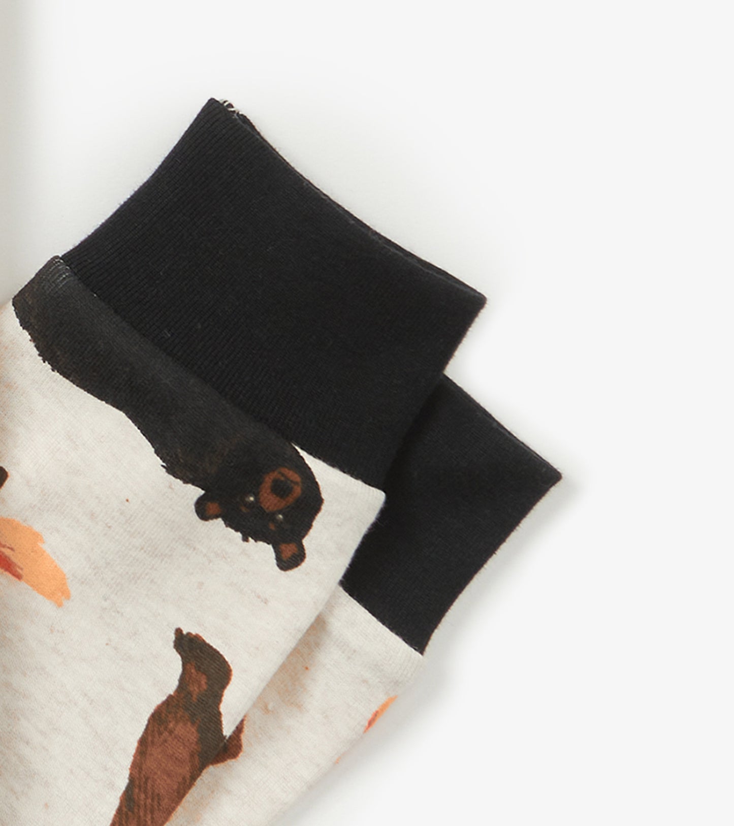 Light gray pajama set featuring animal prints with black cuffs, ideal for kids' sleepwear.