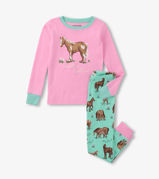 Pink long-sleeve top with horse graphic and turquoise pants featuring horse patterns and floral accents.