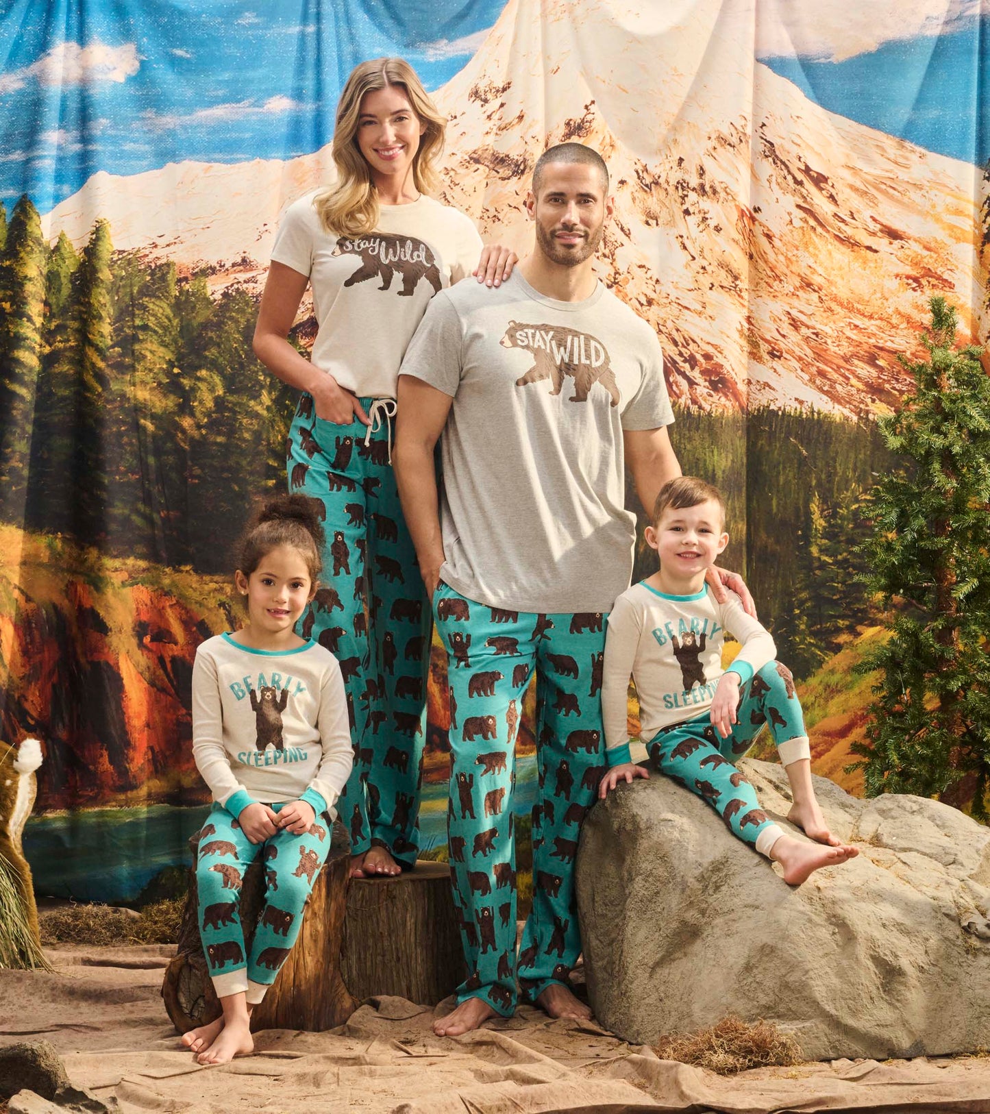 Kids' pajama set featuring bear patterns in teal and cream, suitable for cozy sleepwear.