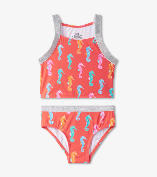 Coral tankini set featuring colorful seahorse prints and silver accents, includes a tank top and matching bikini bottom.