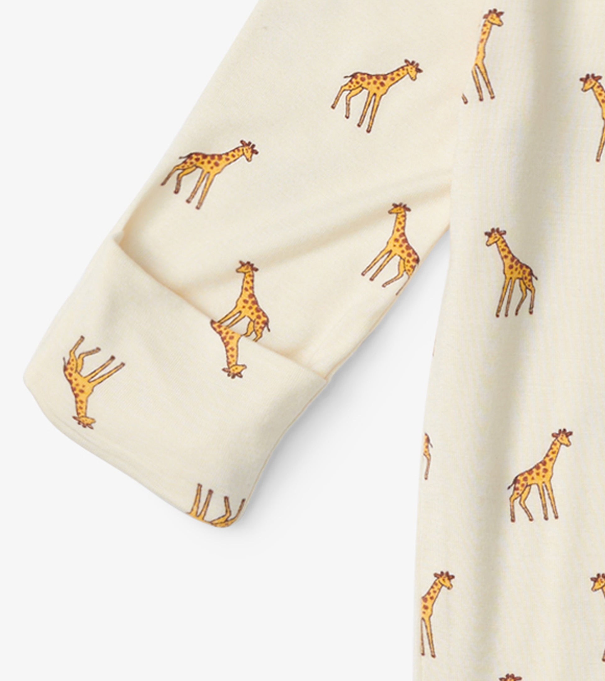Cream footed sleeper featuring playful giraffe prints, designed for baby boys, with long sleeves and soft fabric.