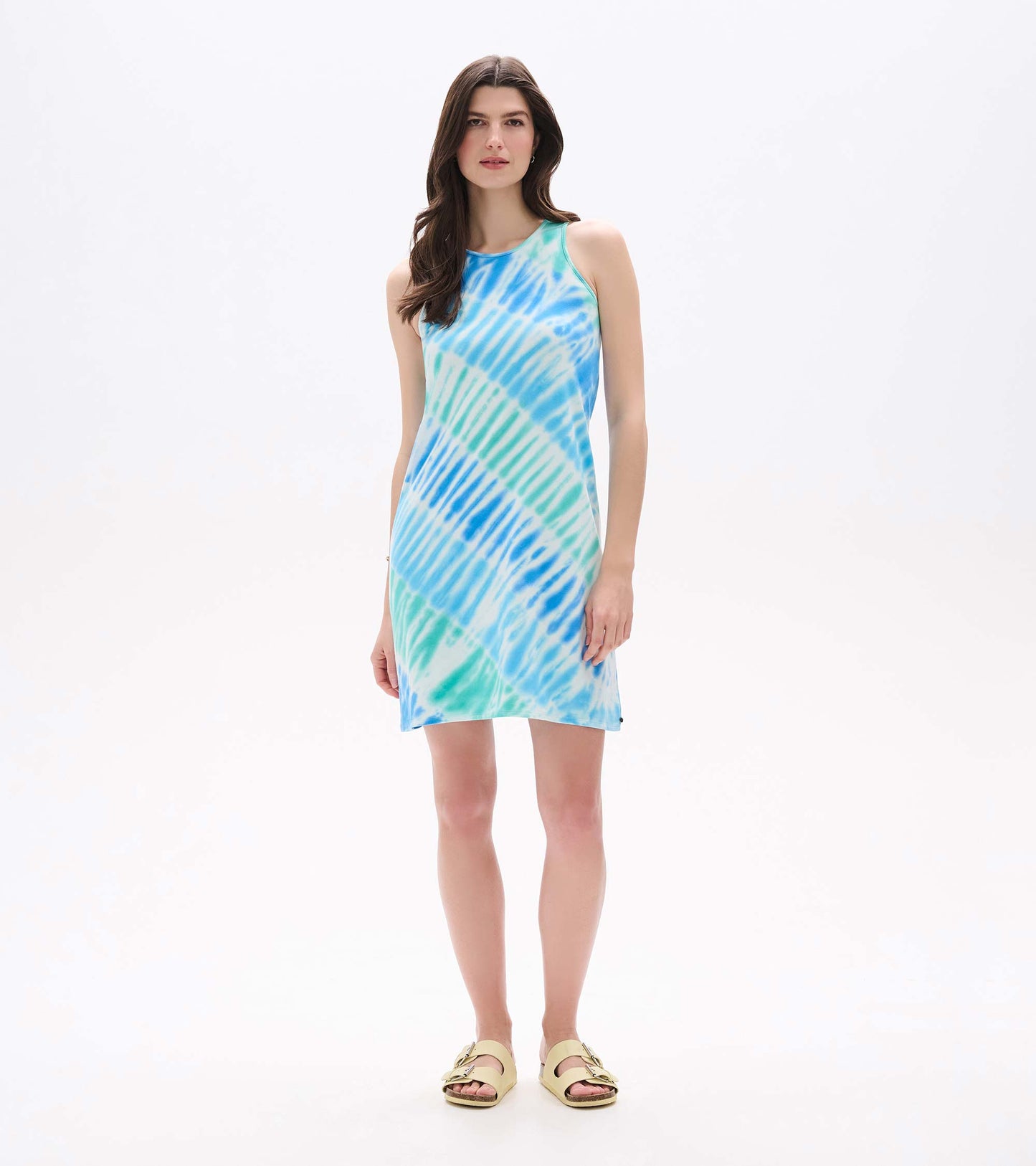 Front full-length view of Bella sleeveless dress in blue and aqua wave tie-dye print