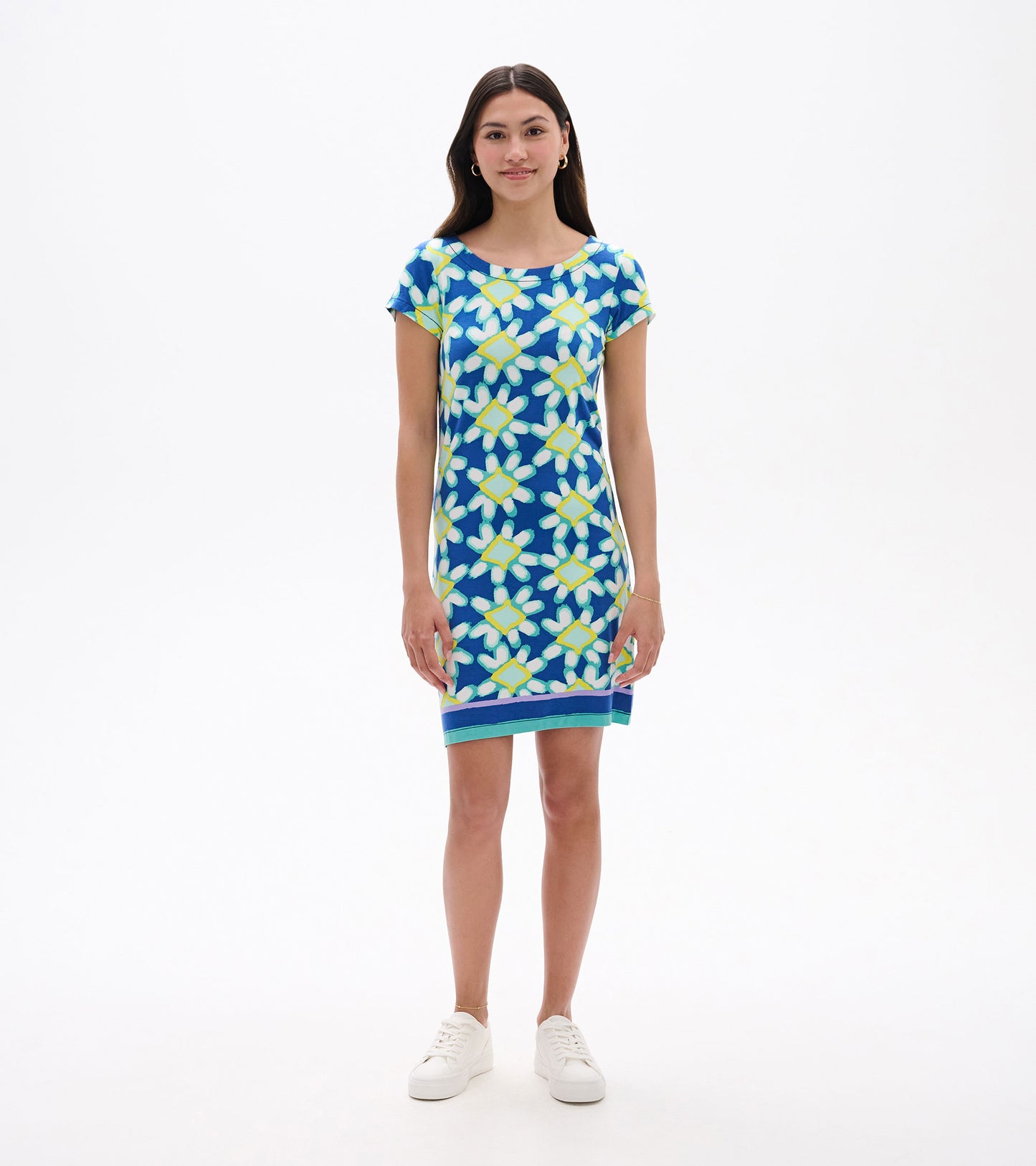 Short-sleeve dress featuring a blue background with a vibrant shibori flower pattern in yellow and green.