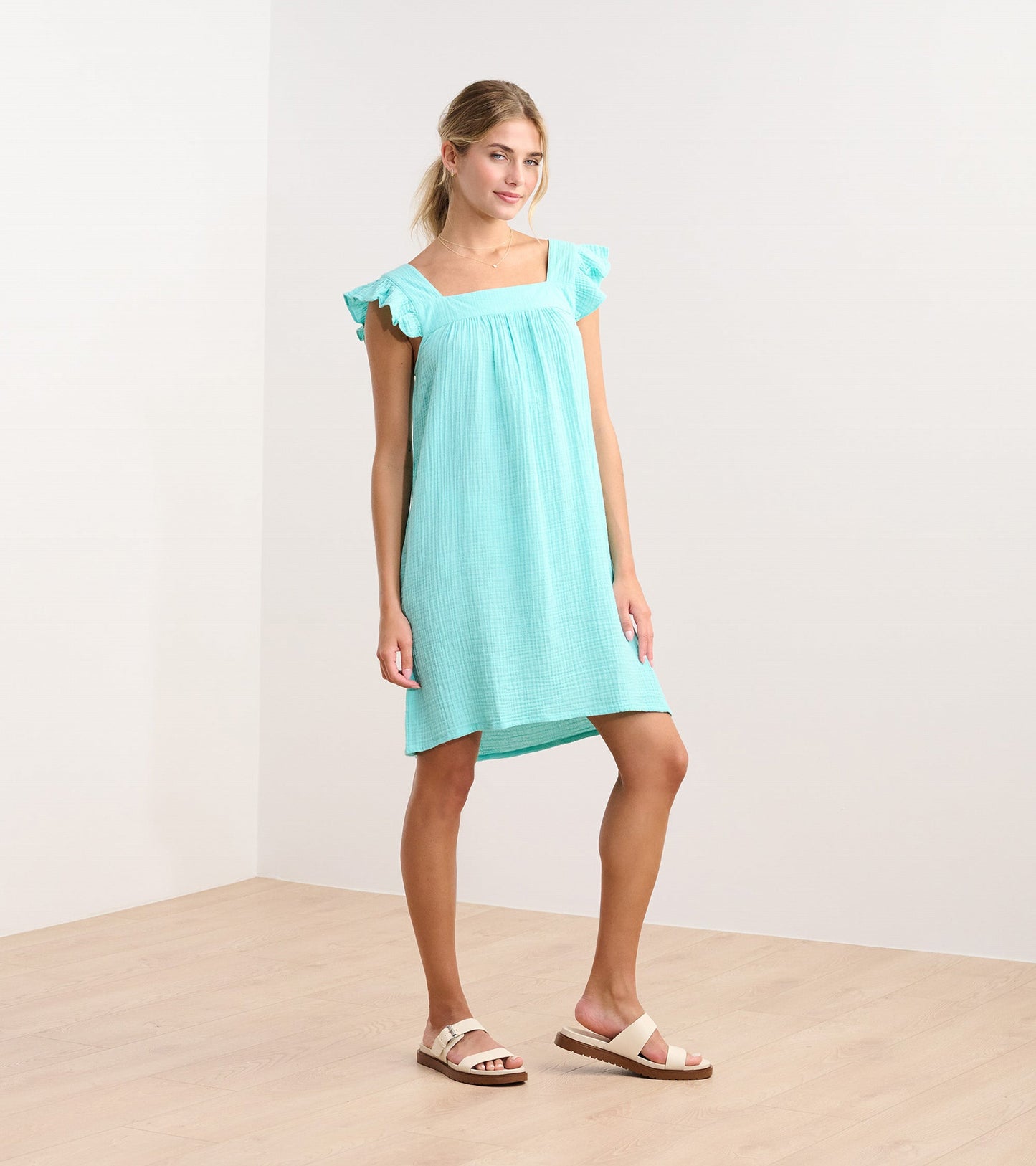 Aruba blue flutter sleeve dress with a square neckline, made from lightweight fabric, styled for casual wear.