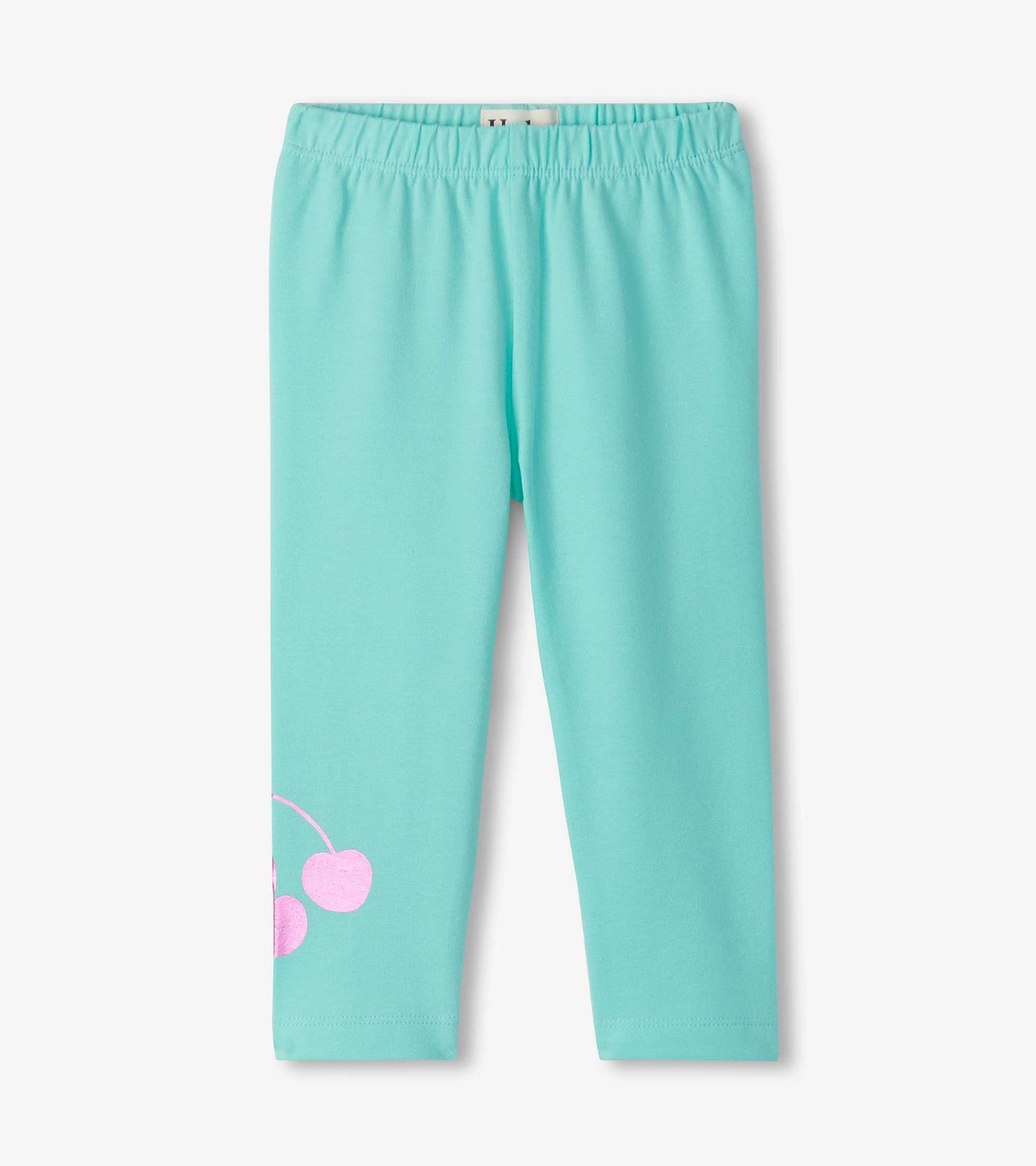 Light blue leggings featuring a pink cherry design on the left leg, made from soft, stretchy material.