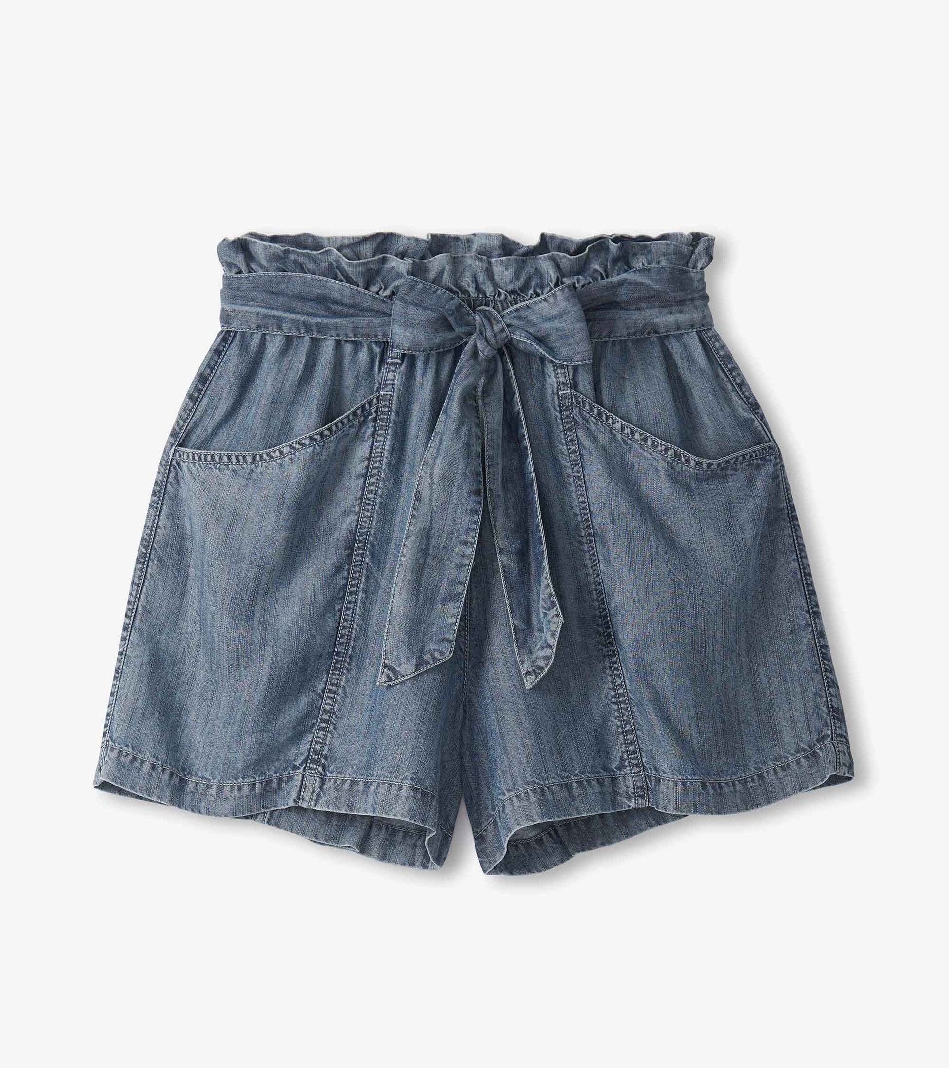 Blue acid wash shorts with a ruffled waistband, tie belt, and two front pockets.