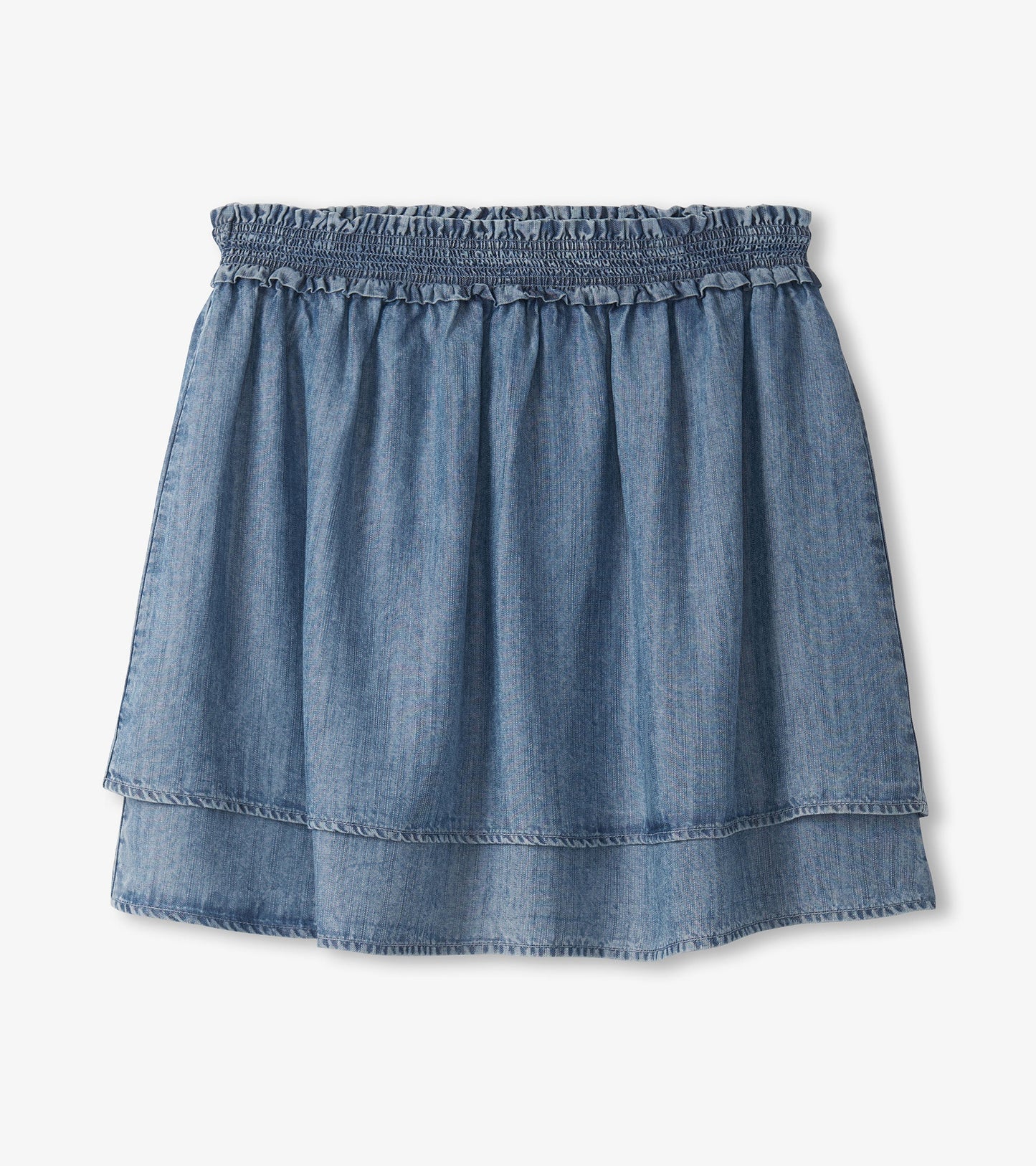 Blue acid wash layered smocked skirt with a ruffled waistband and a relaxed fit.