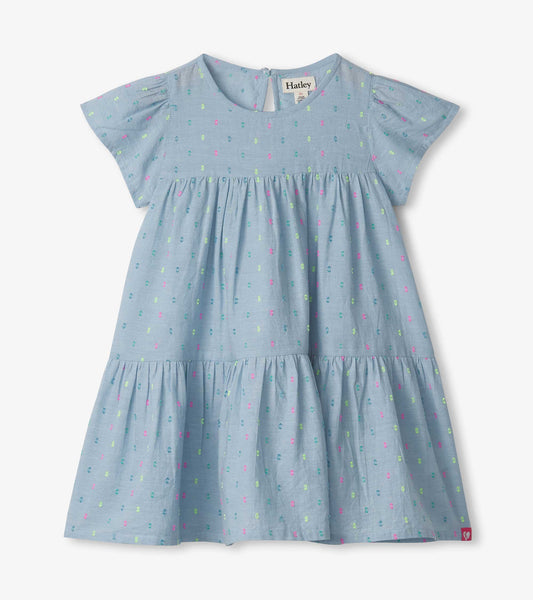 Light blue chambray dress with colorful polka dots, short sleeves, and a tiered skirt design.