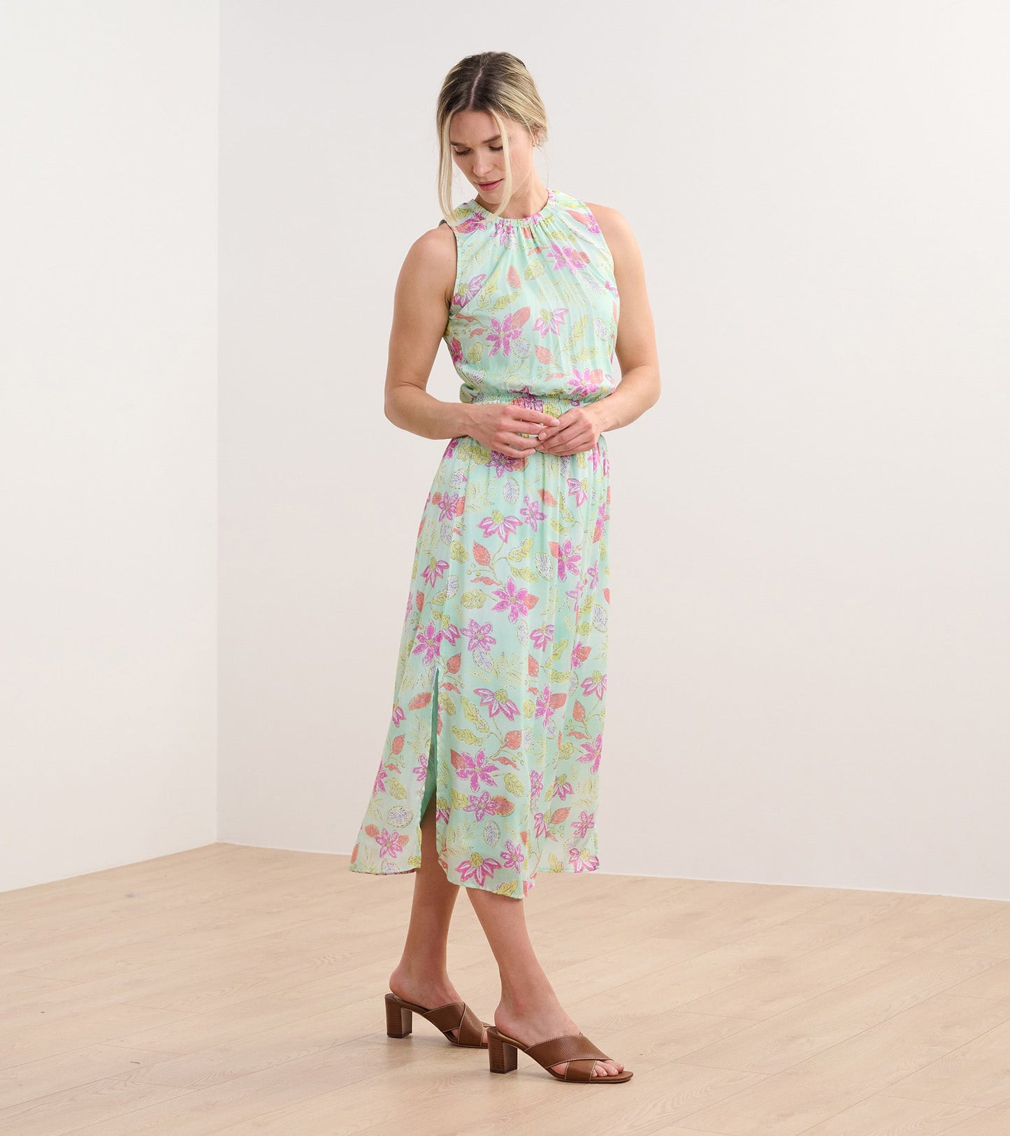 Sleeveless mint green column dress with distressed floral pattern, featuring a gathered neckline and a flowy silhouette.