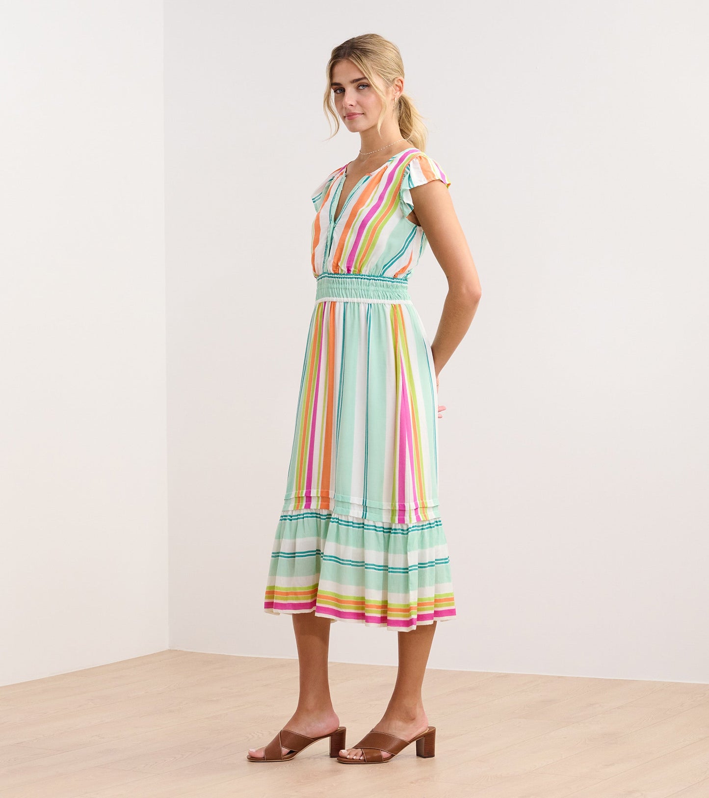 Lightweight midi dress in sea glass with colorful vertical stripes and ruffled sleeves, perfect for casual outings.