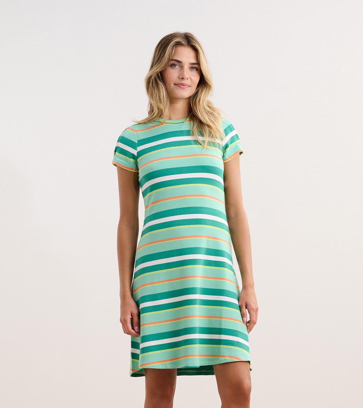 Short-sleeve dress featuring green and white beveled glass stripes with orange accents, knee-length cut.