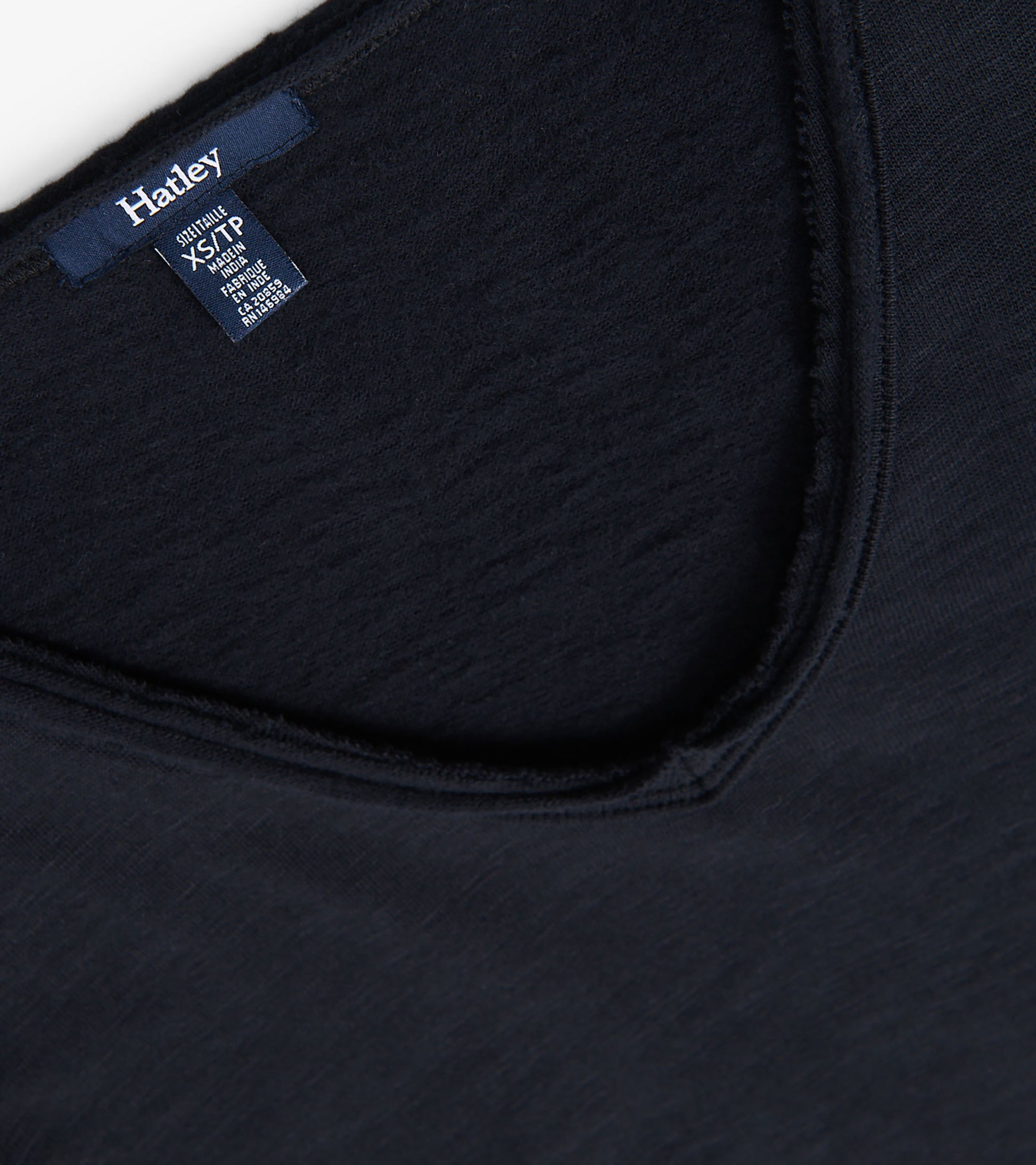 Black V-neck tee with a soft texture and relaxed fit, featuring a slightly frayed neckline.