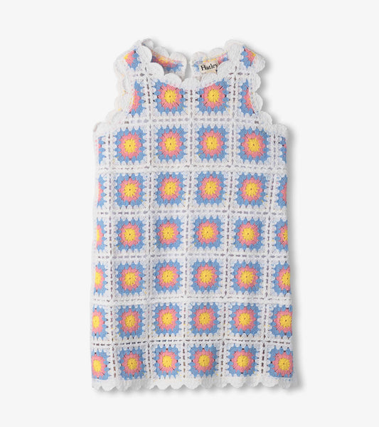 Sleeveless crochet dress featuring a colorful floral pattern in blue, pink, and yellow with scalloped edges.