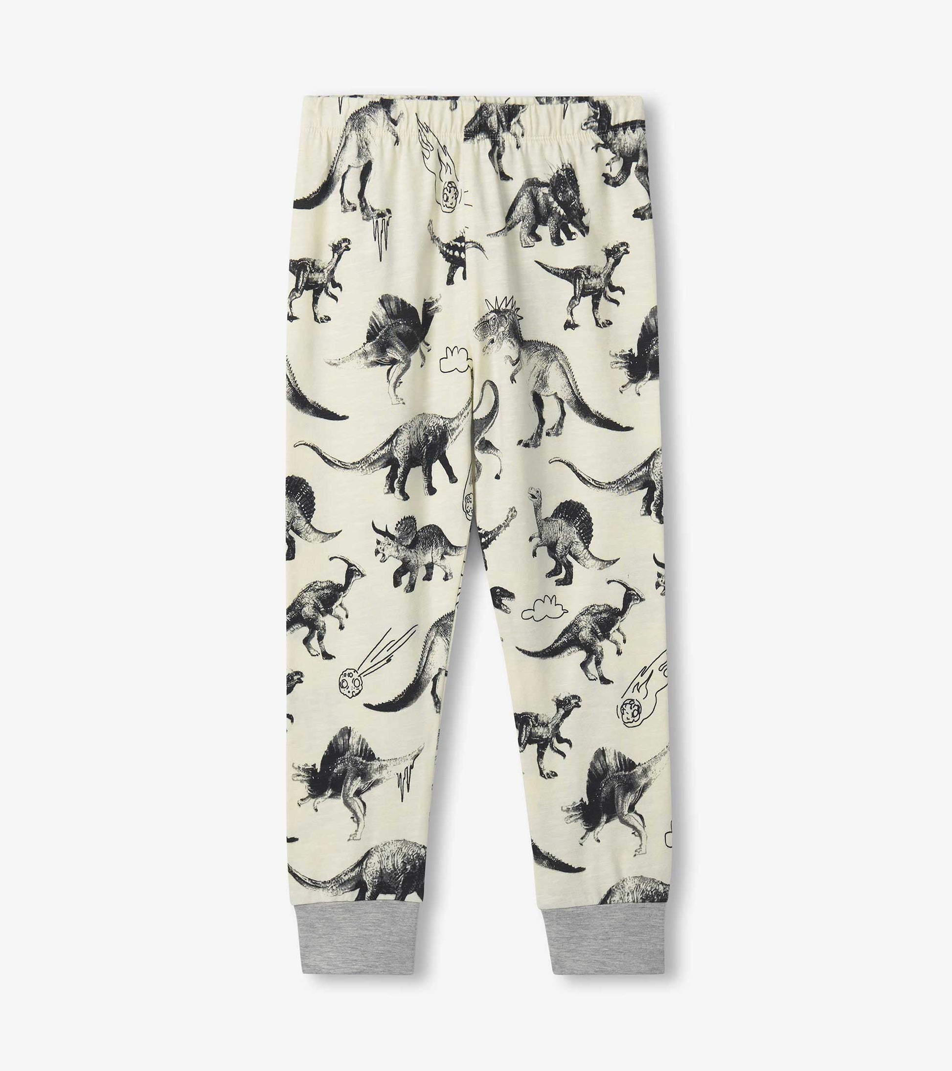 Cream pajama pants featuring a black dinosaur print, with elastic waistband and gray cuffs at the ankles.