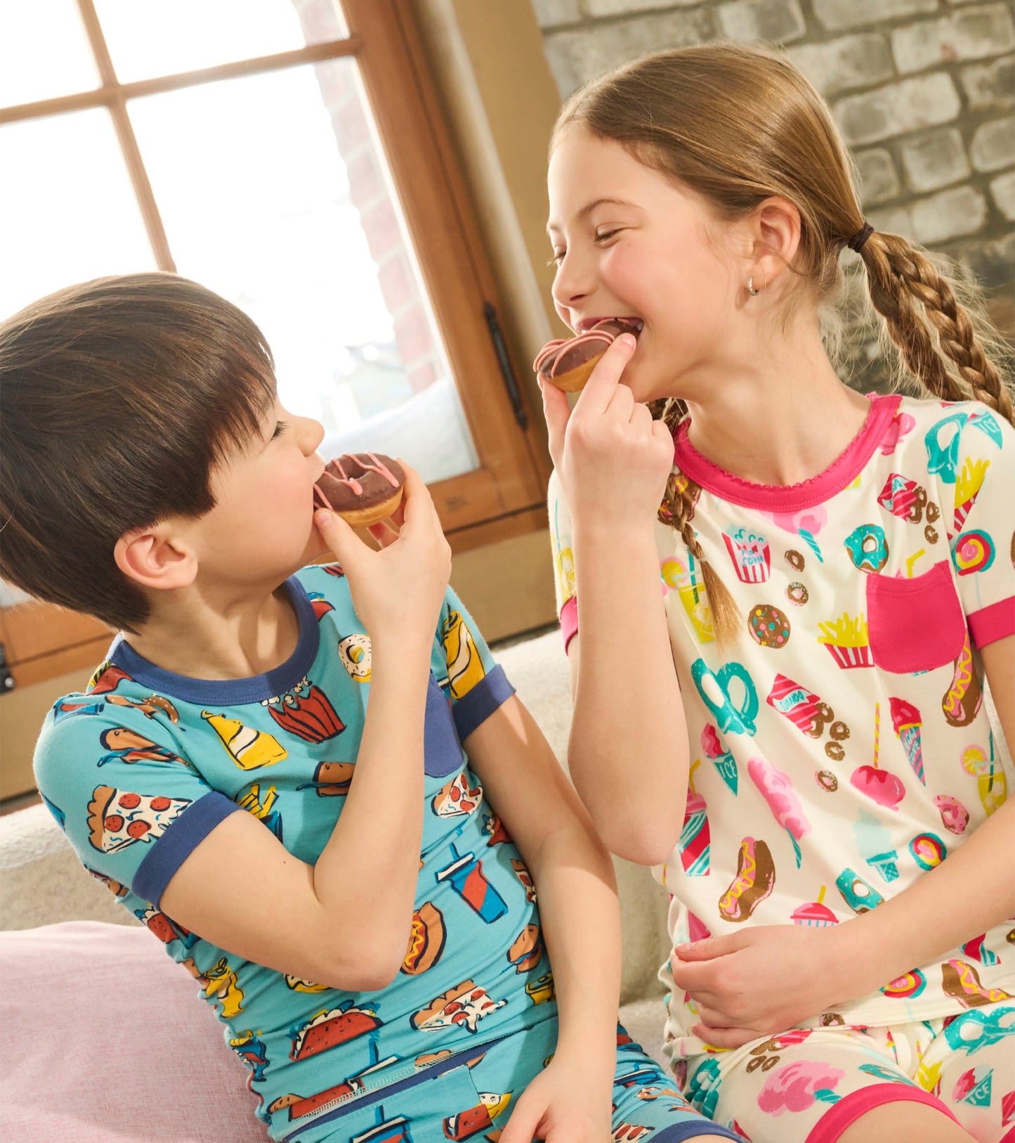 Boys' bamboo short pajama set featuring colorful carnival food patterns, perfect for playful sleepwear.