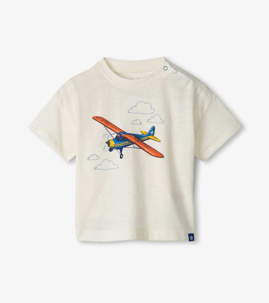 Cream slouchy tee featuring a colorful airplane graphic and cloud designs, suitable for baby and toddler boys.