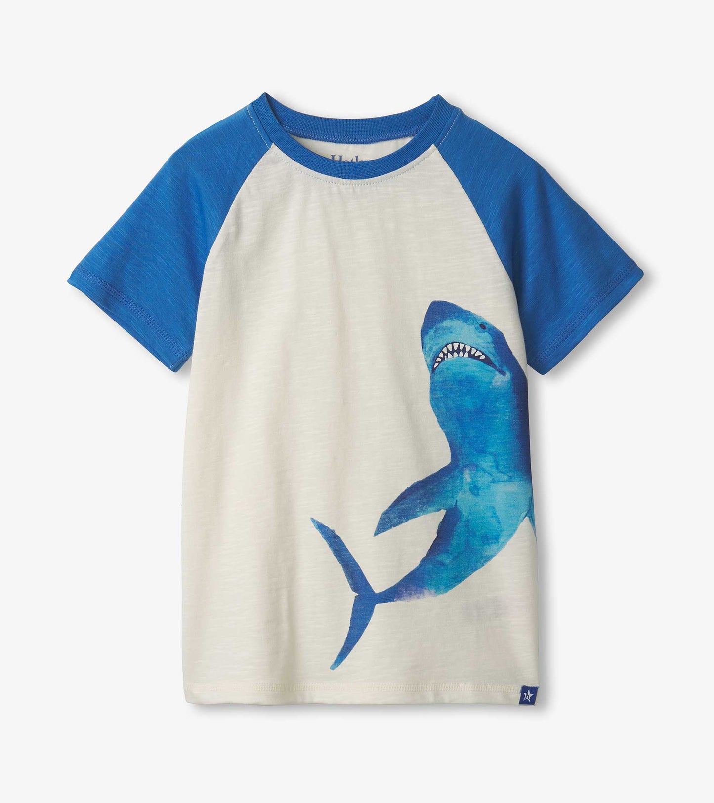 Boys' raglan t-shirt featuring blue sleeves and a large blue shark graphic on a cream body.