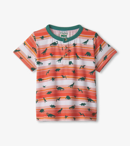Short-sleeve henley shirt featuring orange and white stripes with green dinosaur silhouettes throughout.