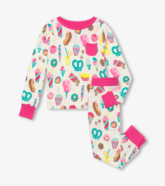 Bamboo pajama set featuring colorful carnival treats on a cream background with pink accents on the cuffs and pocket.