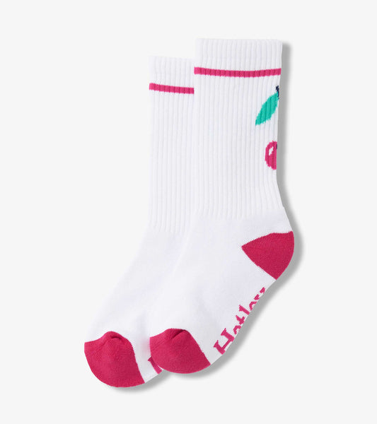 White tube socks with pink accents and cherry pattern, suitable for girls aged 2-12.