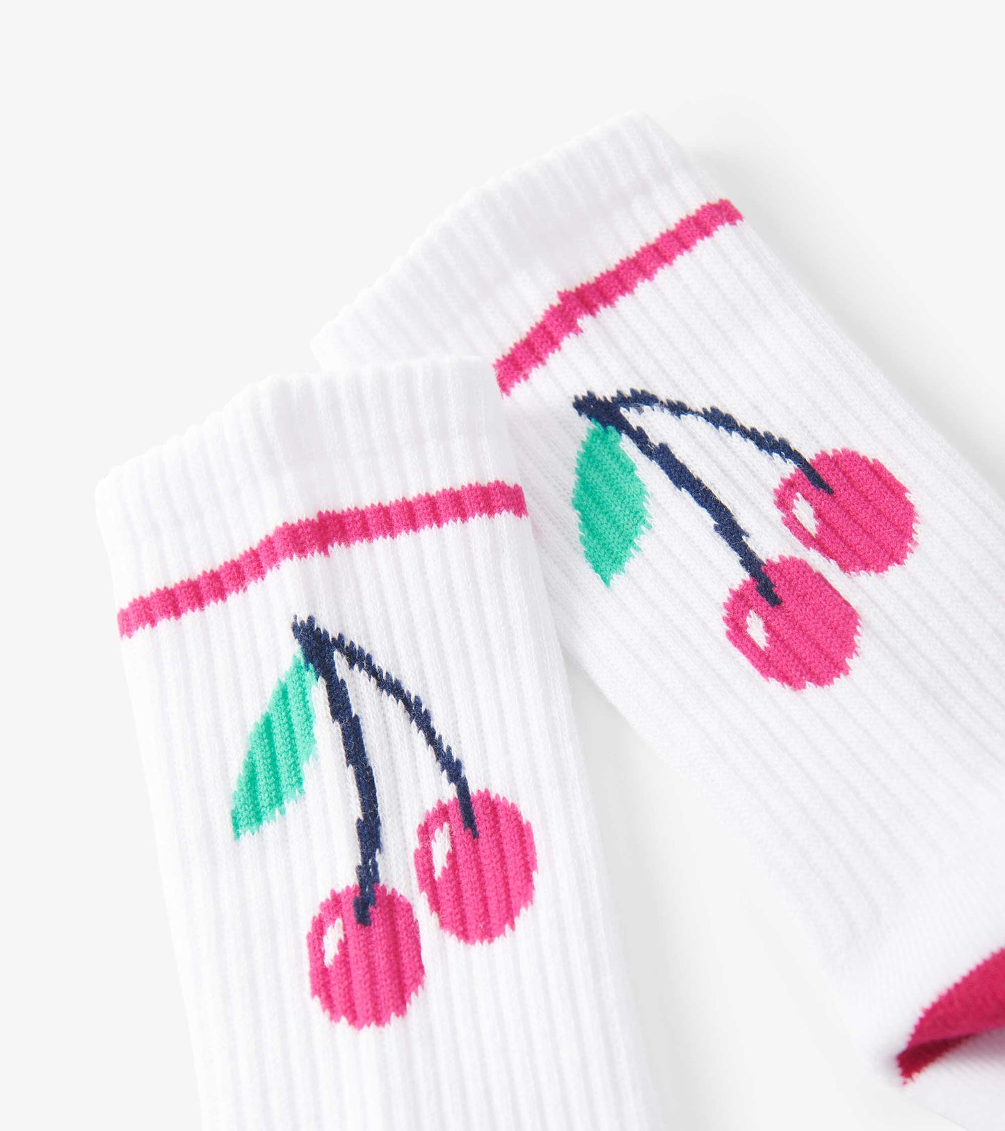 White tube socks featuring a cherry pattern with pink accents, suitable for kids aged 2-12.