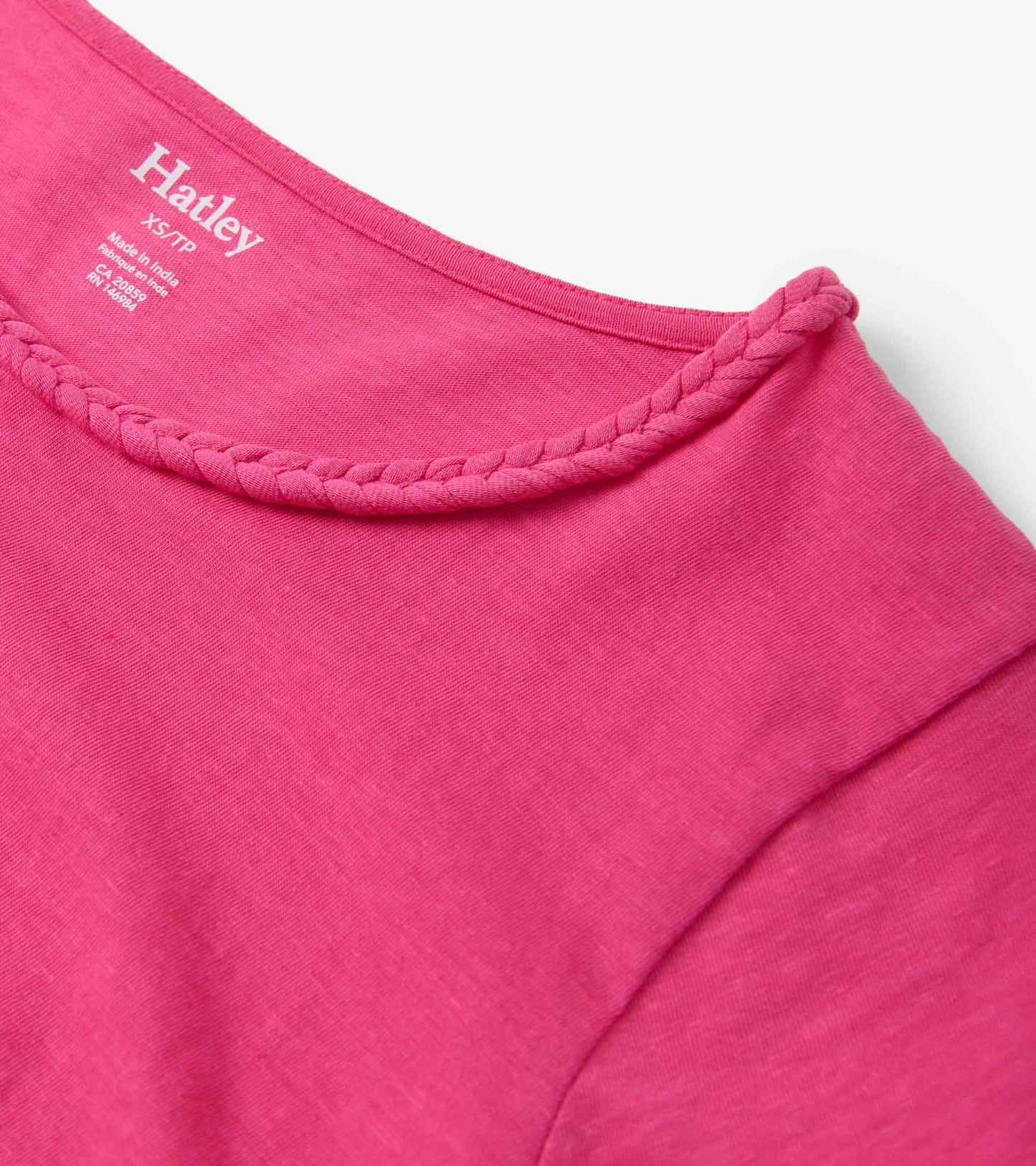 Fuschia braided neck tee with a soft fabric, showcasing a round neckline and short sleeves.