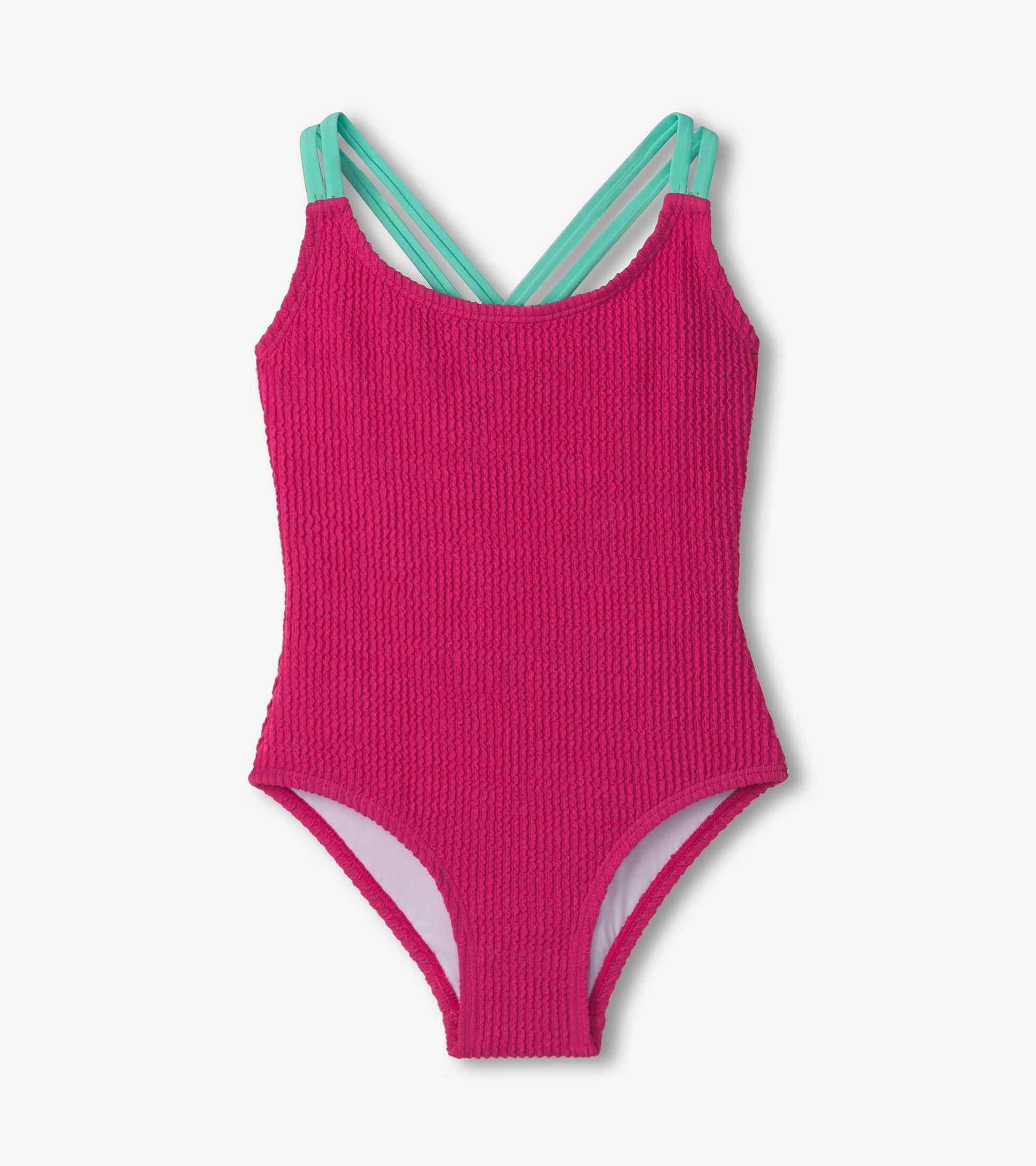 Fuchsia purple cross strap swimsuit with textured fabric and contrasting mint green straps.