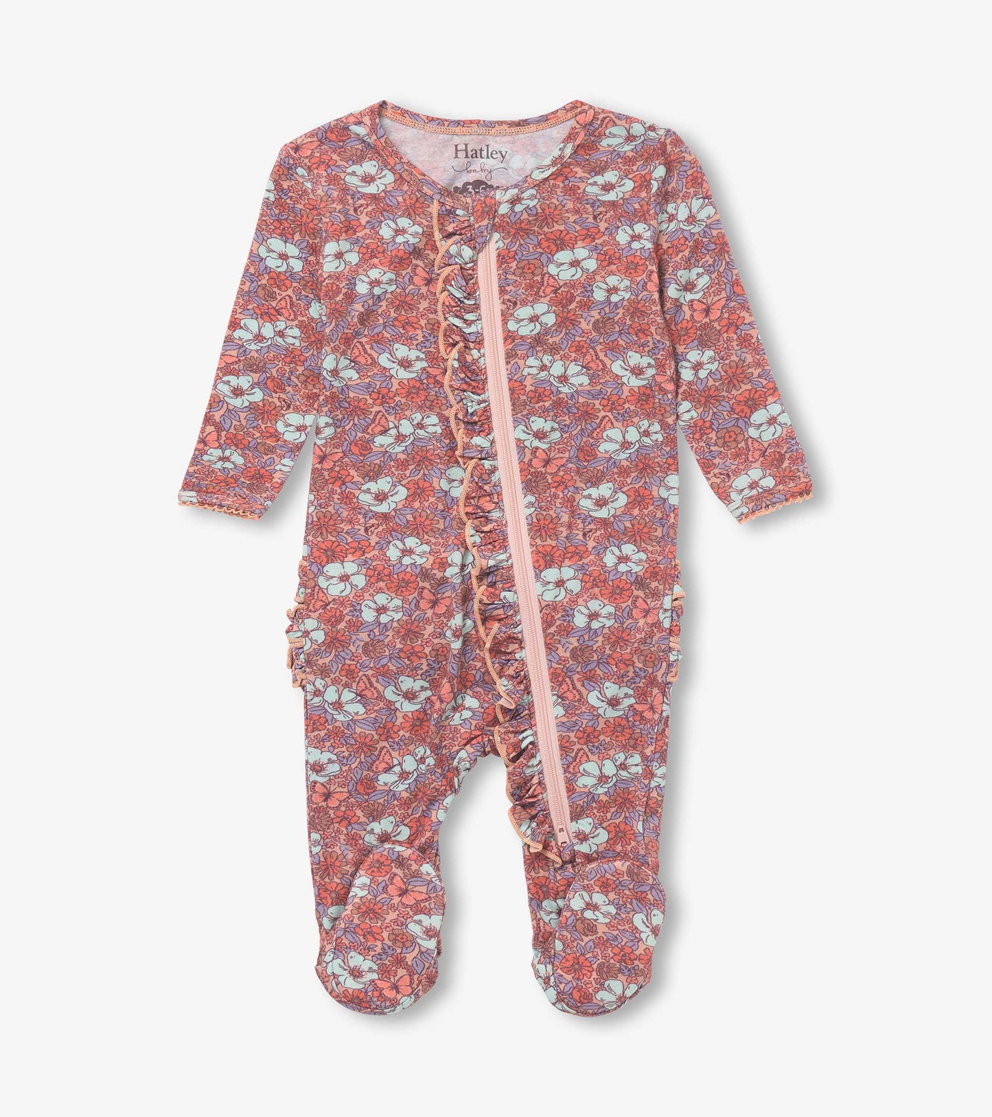 Pink footed sleeper with a groovy floral pattern, featuring long sleeves and a front zipper closure.