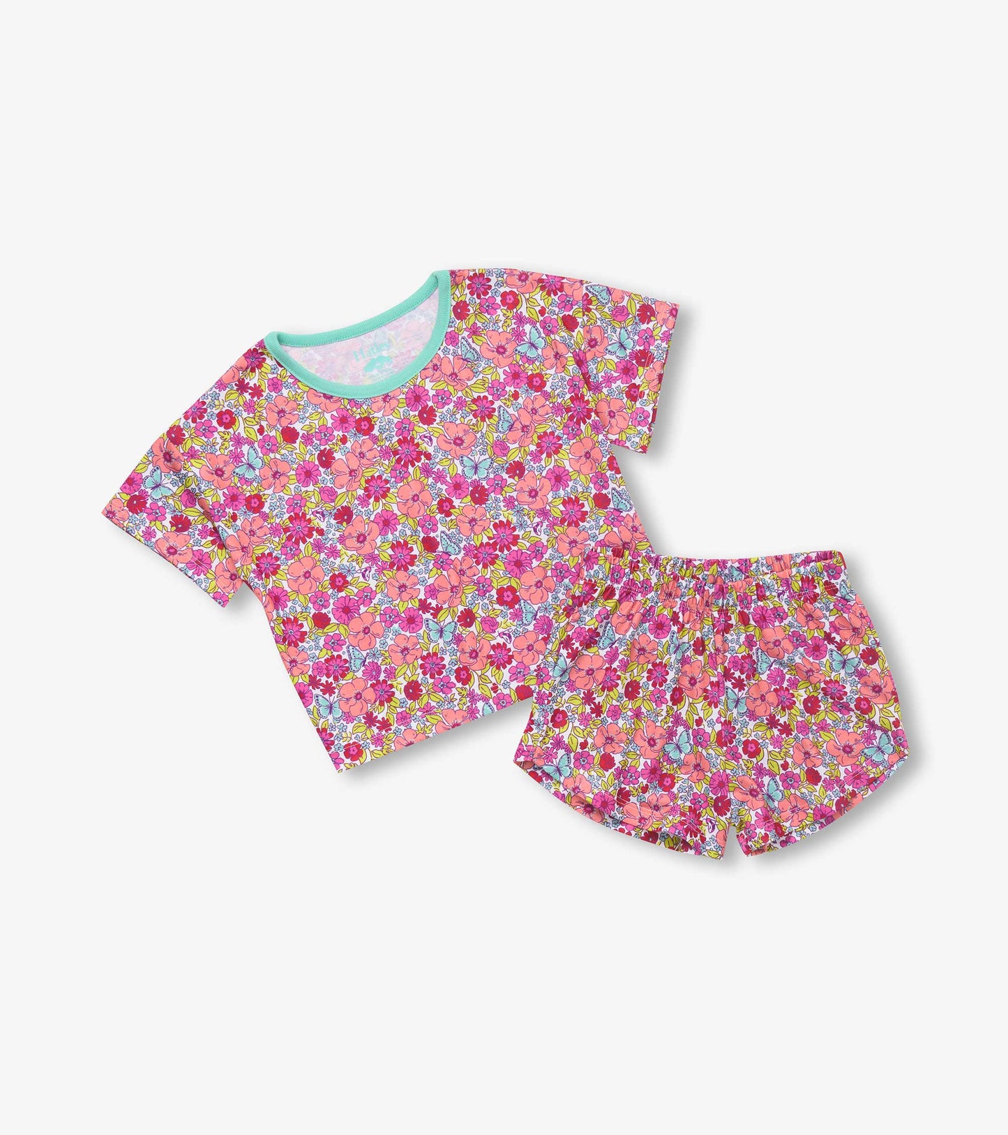 Pink floral short-sleeve tee and matching shorts set, featuring a vibrant flower pattern and a soft, comfortable fabric.