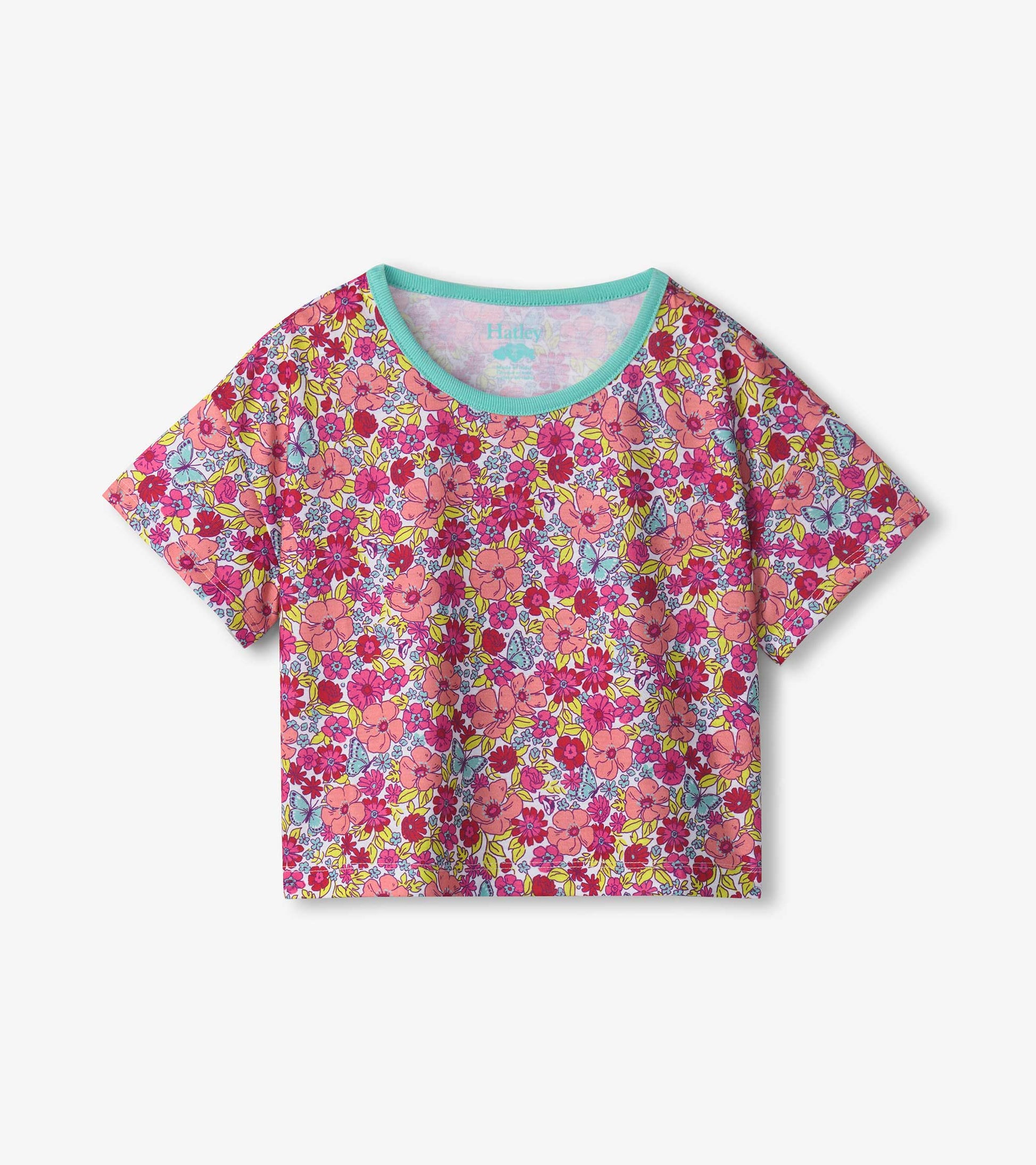 Pink short-sleeve tee featuring a colorful floral pattern with blue trim, designed for girls' sleepwear.