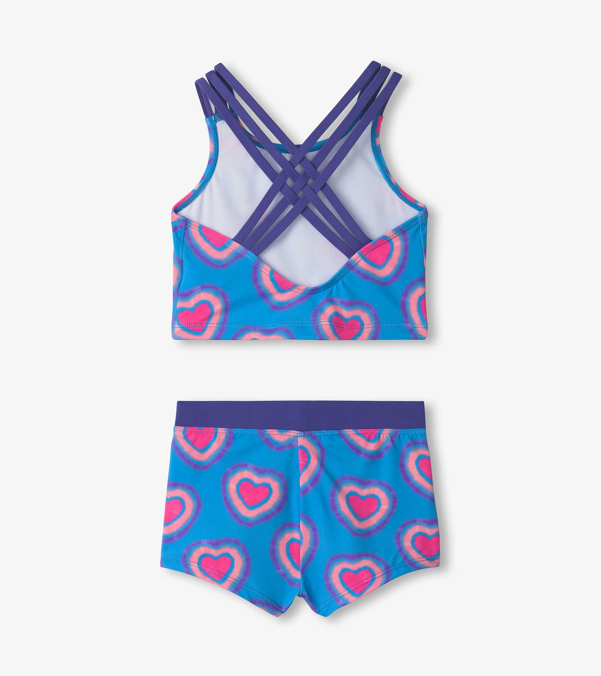 Blue two-piece swimsuit featuring a heart pattern, with a crisscross back design and matching shorts.