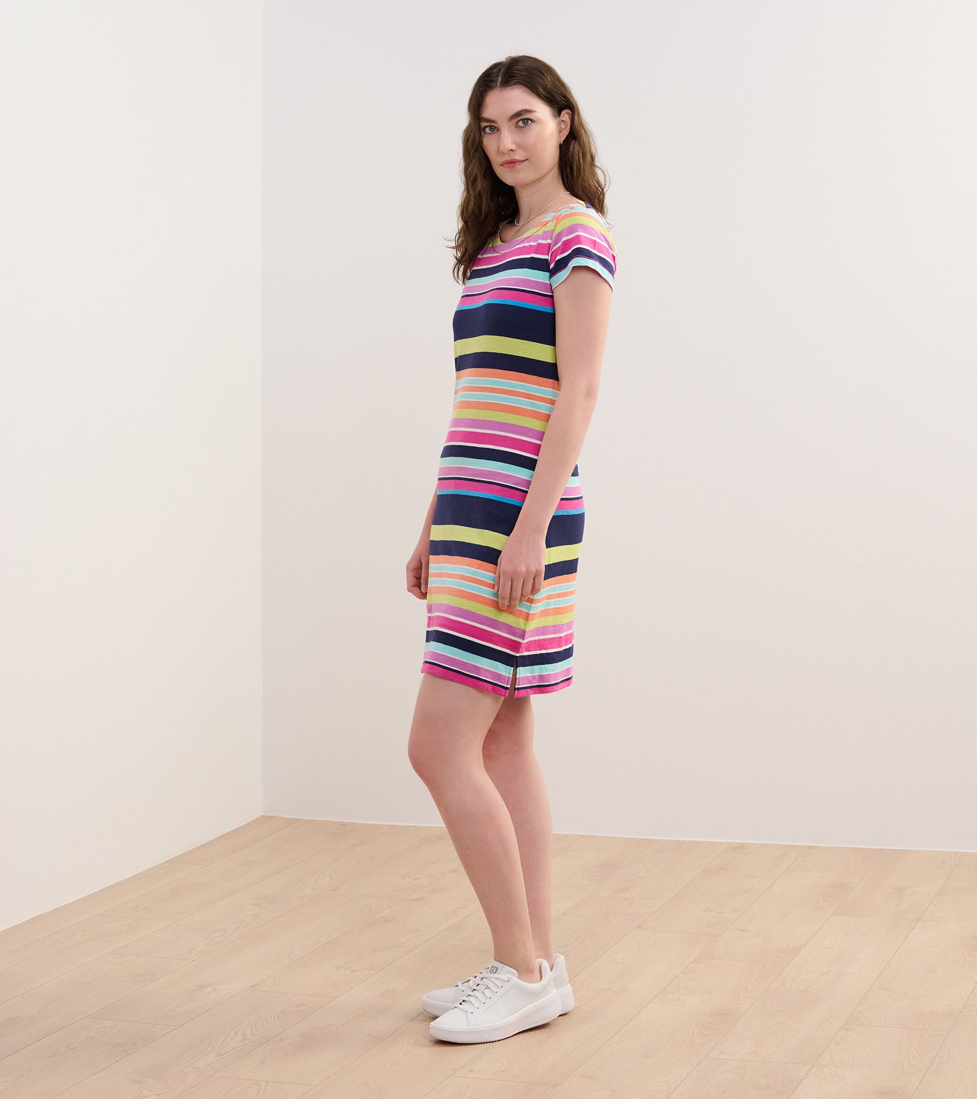 Short-sleeve dress featuring colorful horizontal stripes, knee-length cut, and a relaxed fit.